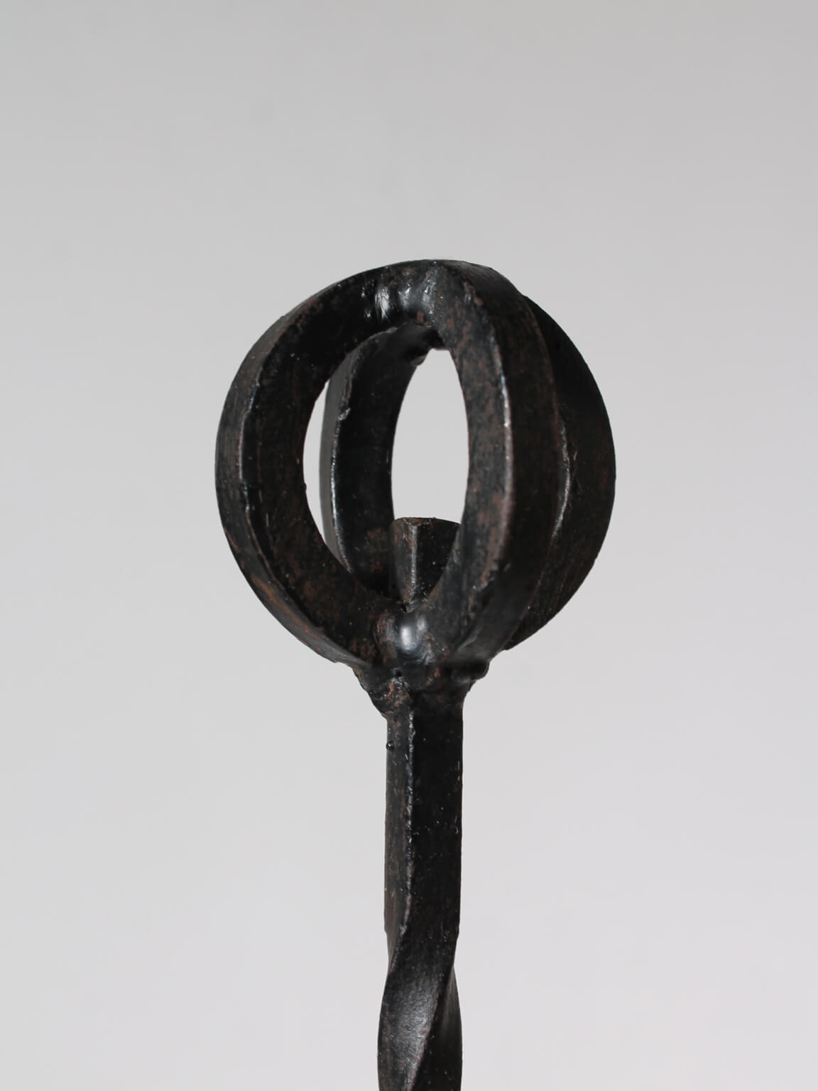 Cast Iron Brutalist Chandelier — side angle highlighting circular candle holder