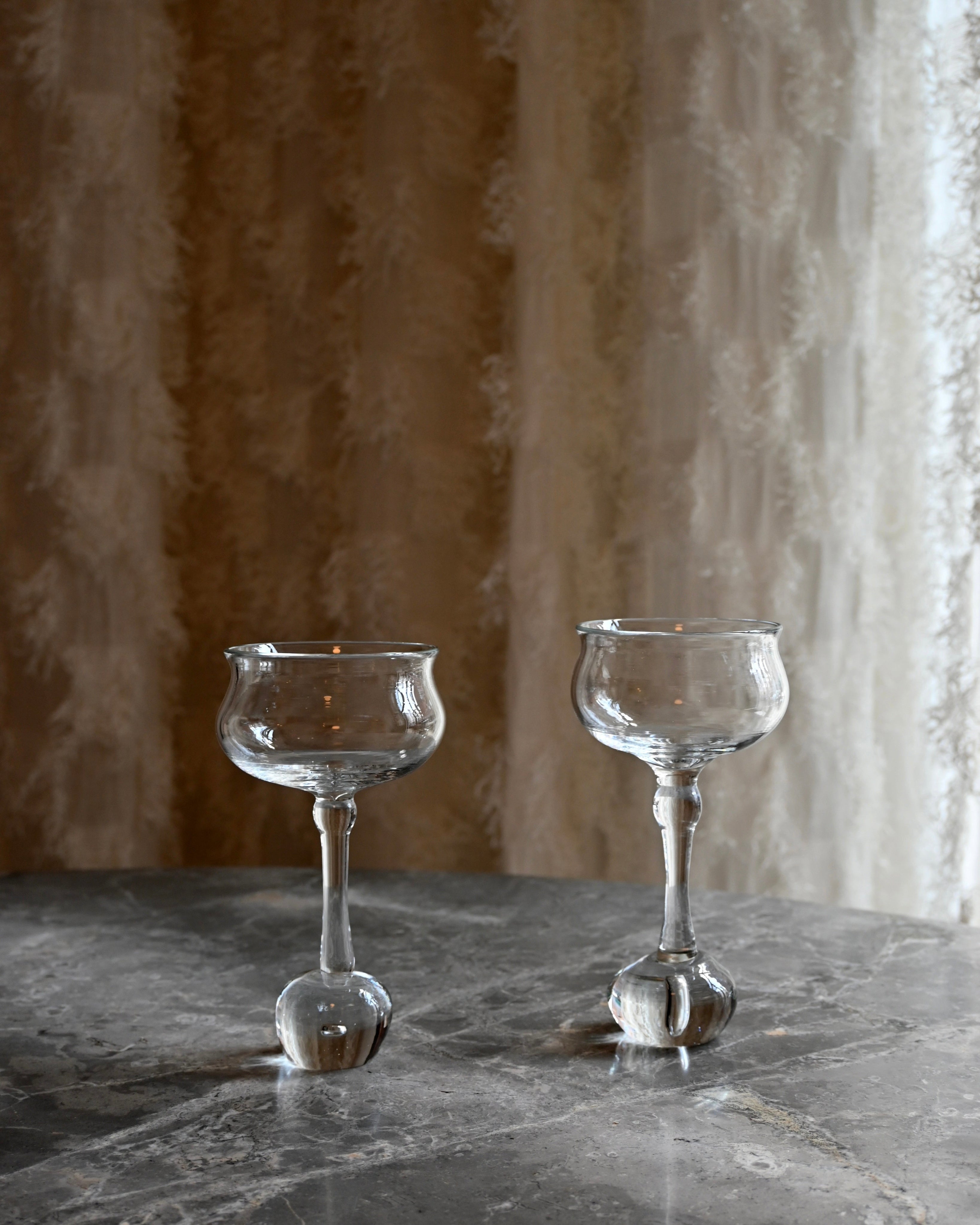 EDEN Wine Glass - Set of 2 — close-up on marble table with textured glass