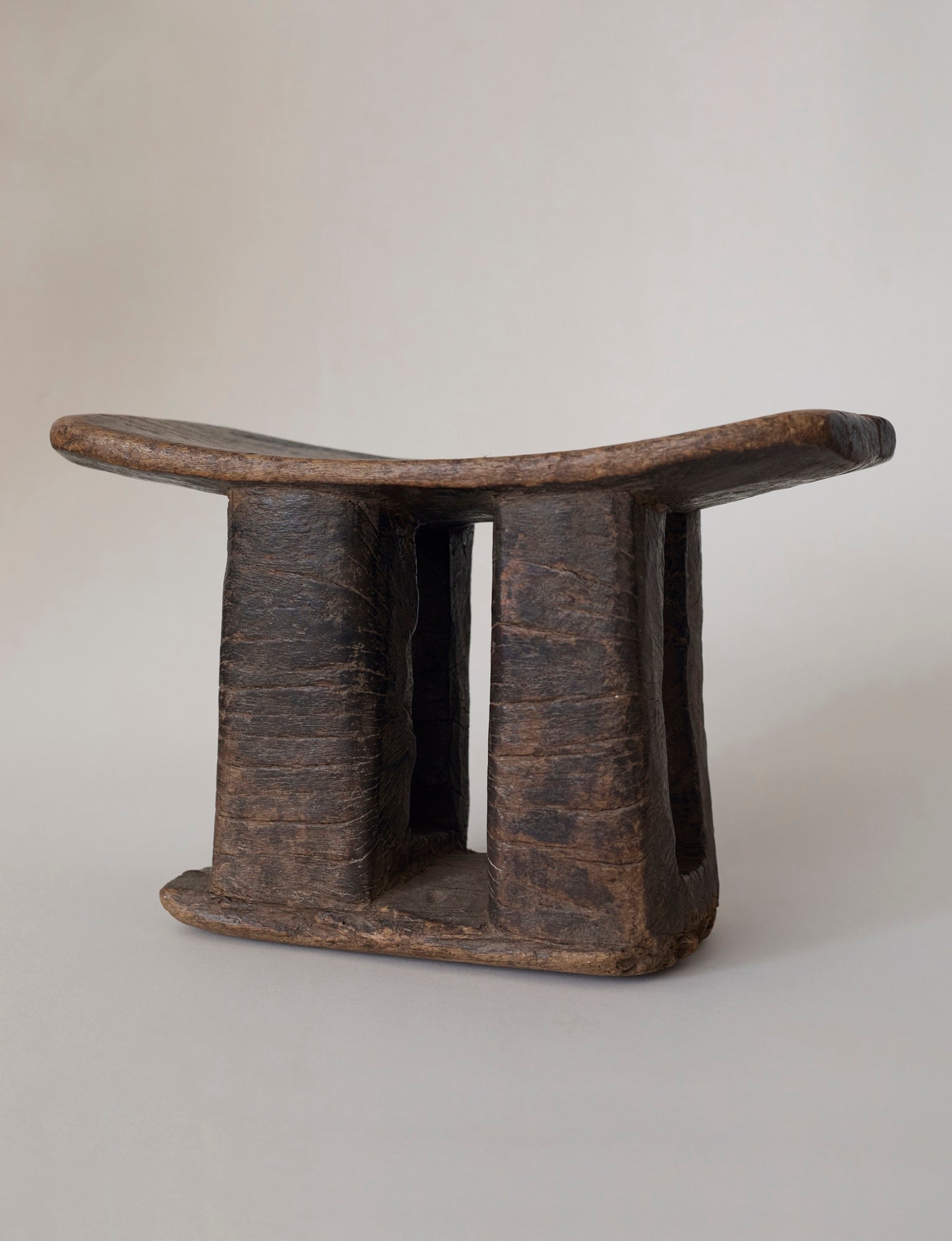 West African Monoxyle Stool in Dark Patinated Wood — side angle