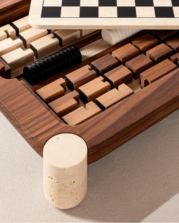 Open walnut chess set showing interior compartments and game pieces