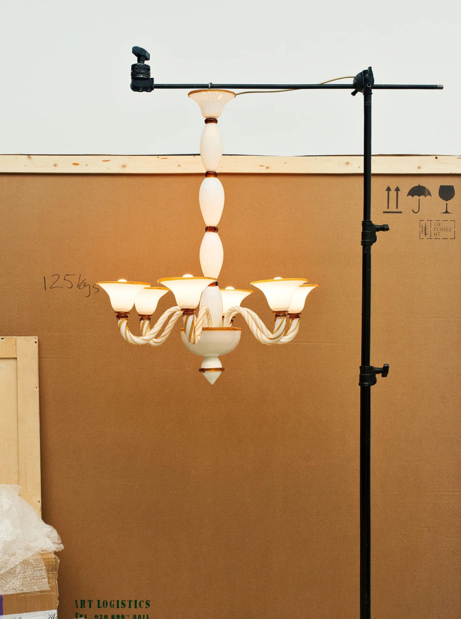 Rosenborg Chandelier — close-up of white ceramic and brass details