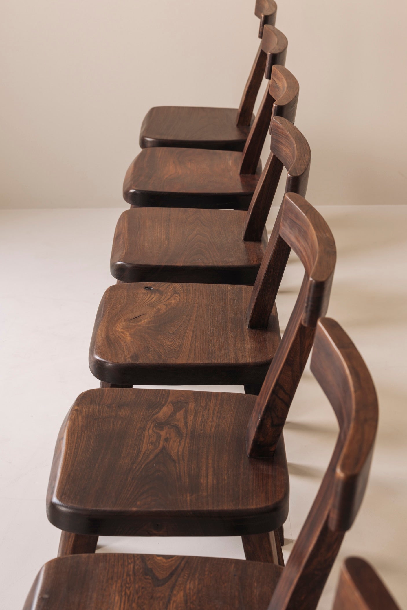 Large set of 8  Brutalist wooden T chairs by Aranjou, France 1960s. — in context