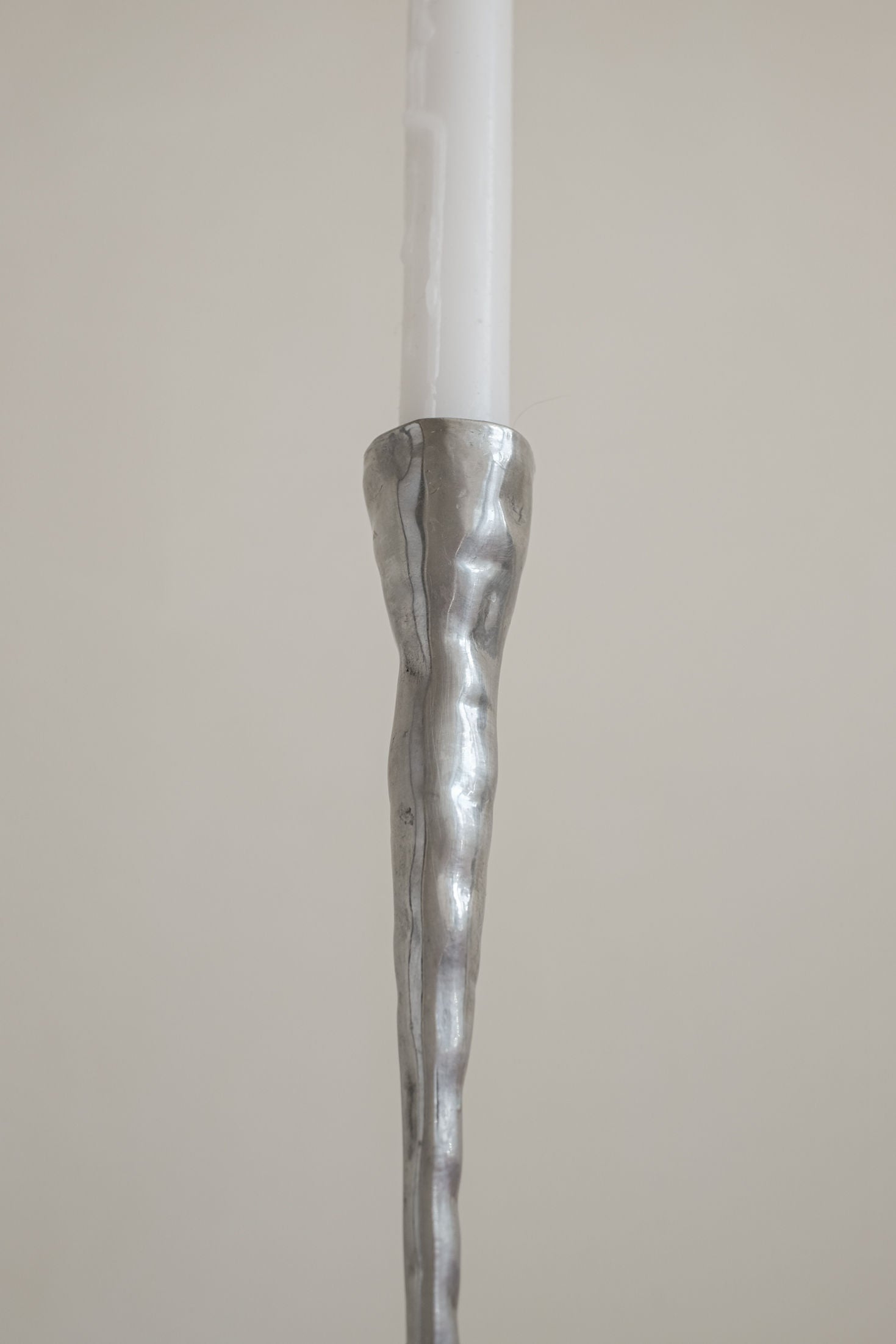 Pair of Aluminium Candle Holders — close-up of textured silver surface