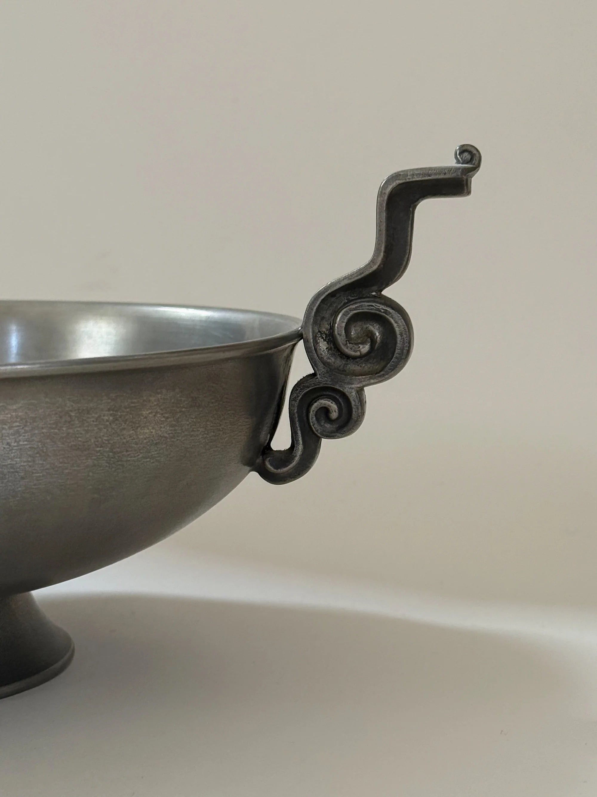 Pewter Bowl with Scroll Handles Edvin Ollers, 1952 — close-up of scroll handle detail