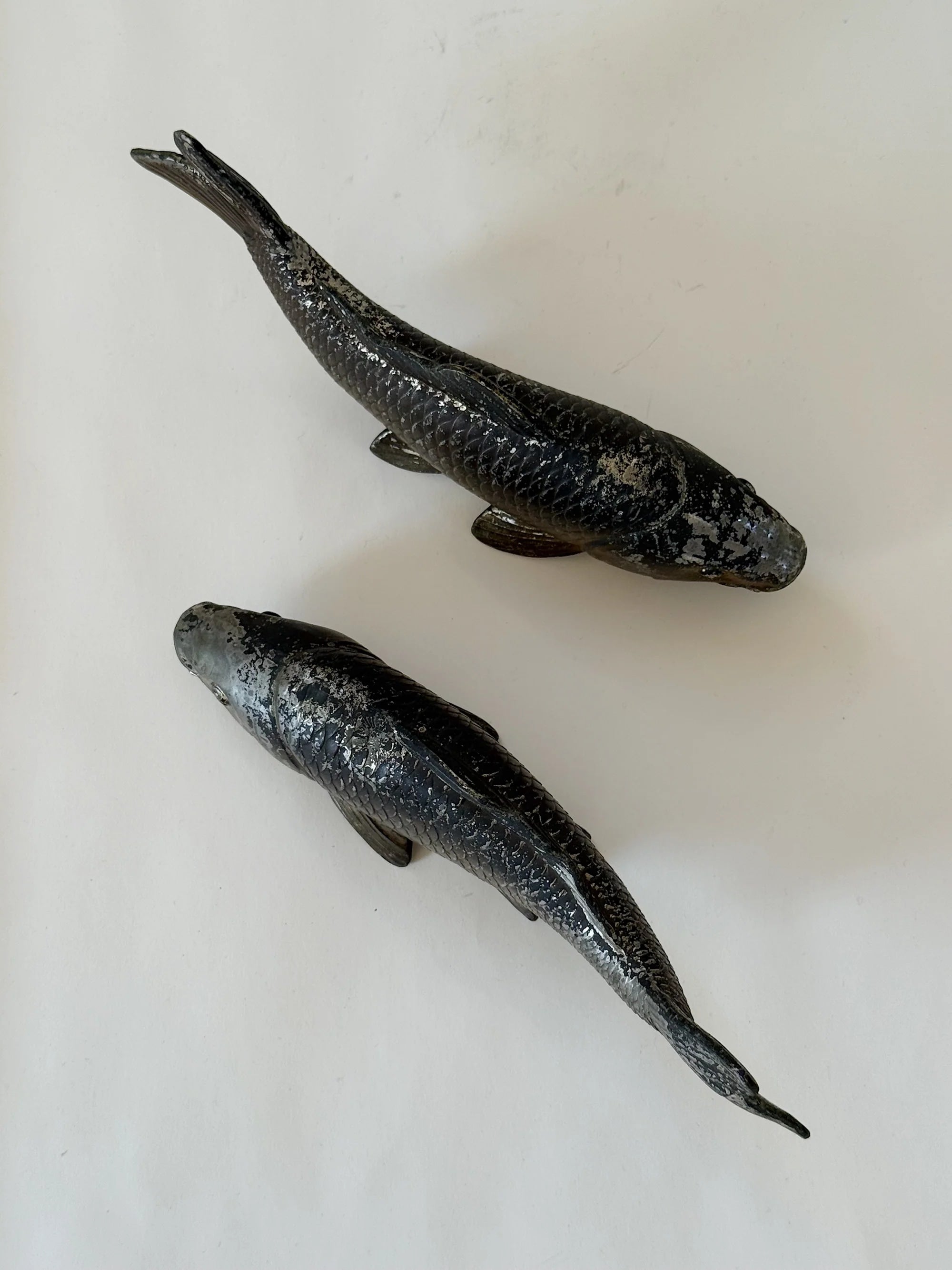 Cast Metal Koi Fish, Japan — top view of two fish sculptures