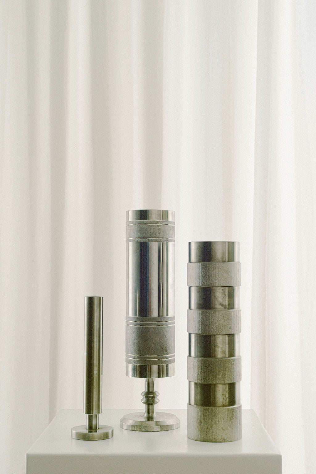 Stainless Steel Brutalist Rod Vase, Slender — close-up of textured metal surface