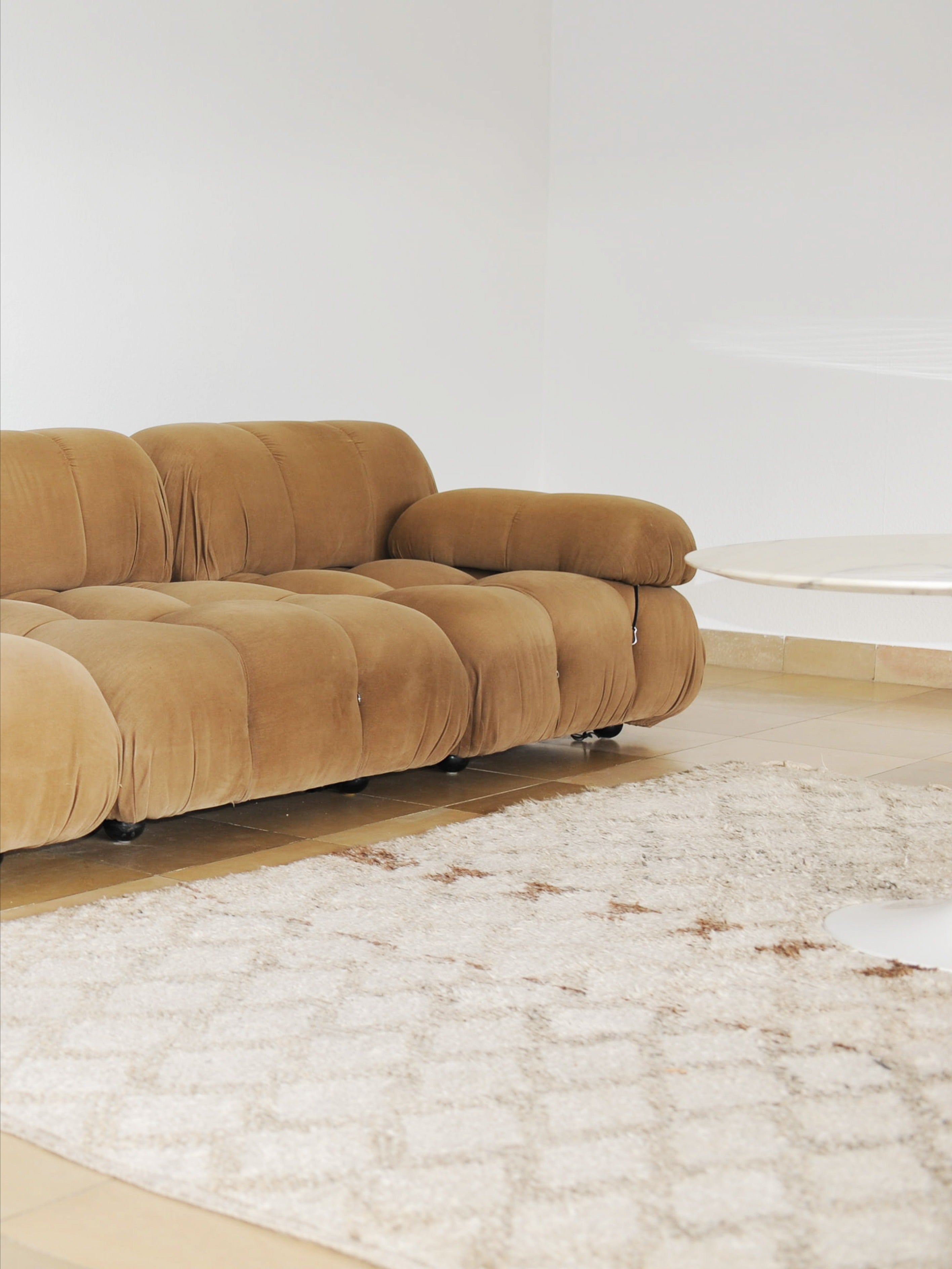 Ivory Moroccan Beni Ouarain Berber Rug 270 x 170cm — laid on tiled floor beside brown sofa