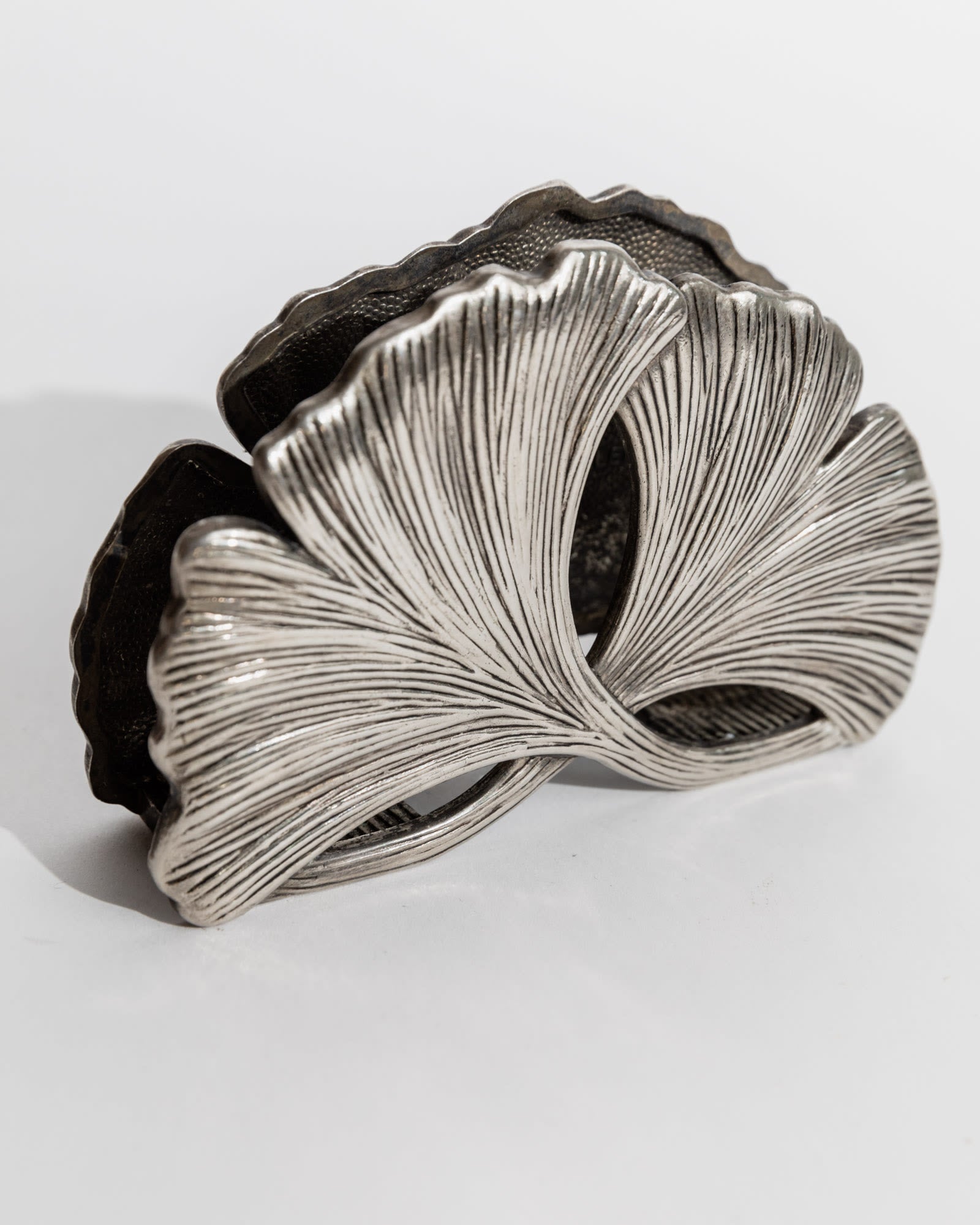 Sculptural silver plated desk holder with ribbed organic curves