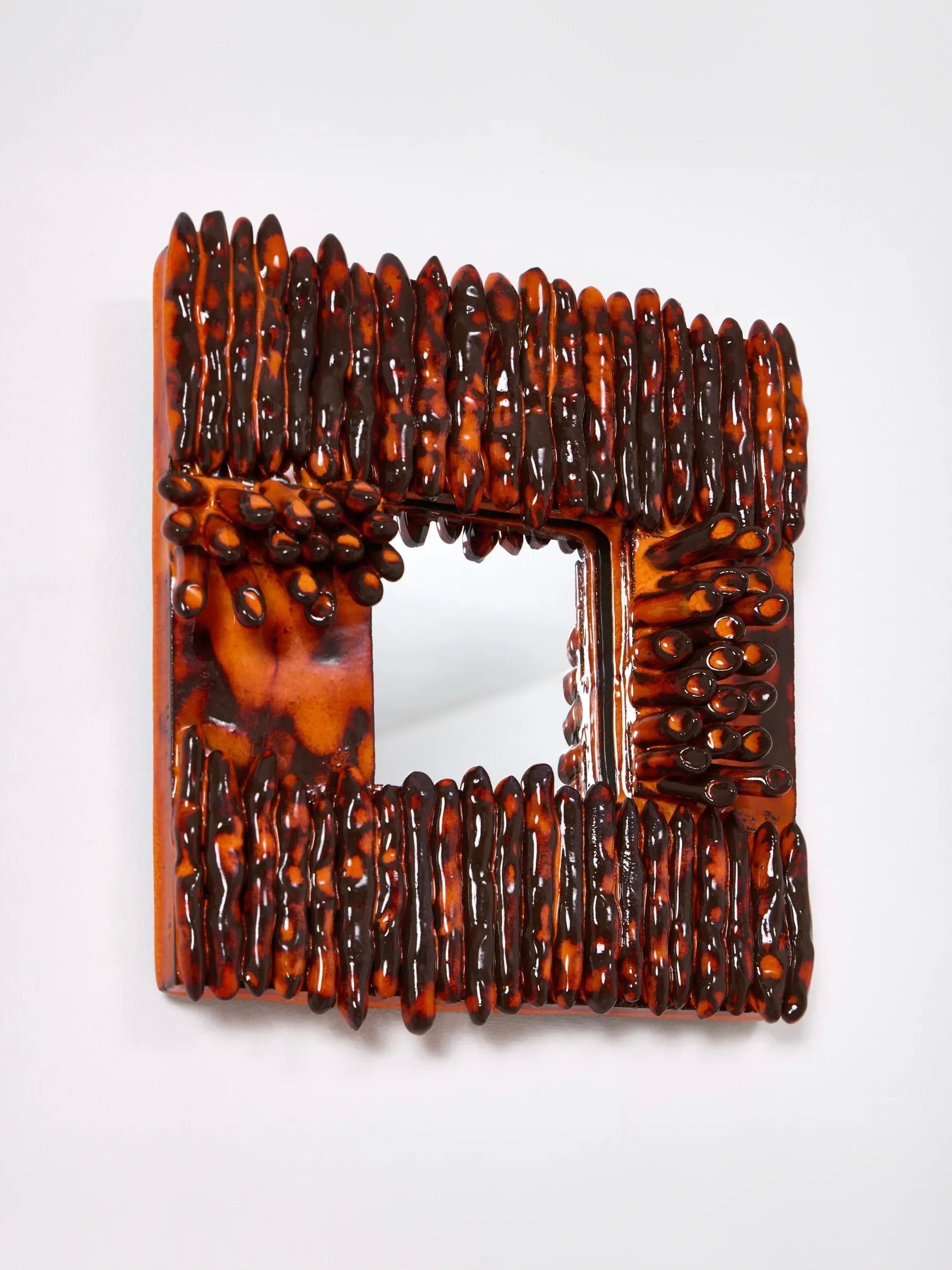 Dedo' Ceramic Mirror — side view highlighting textured ceramic surface