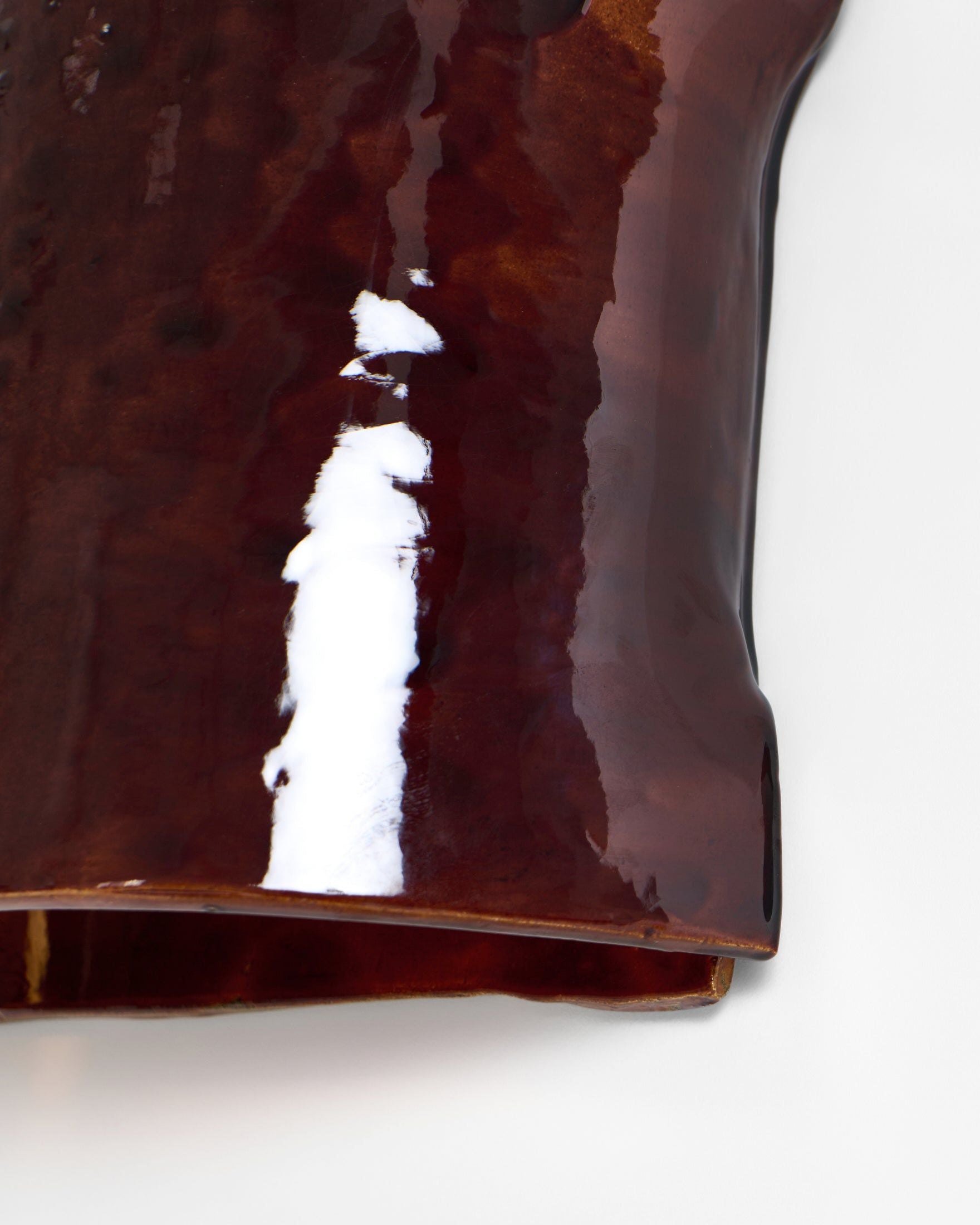 Papel Wall Light — top view of glossy brown ceramic surface