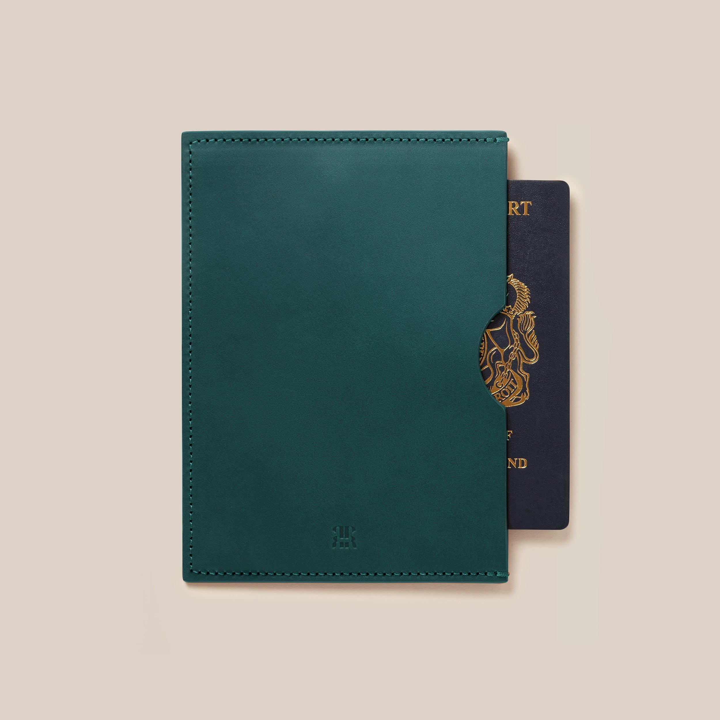 Leather Passport Holder — top view with dark green leather and passport inside