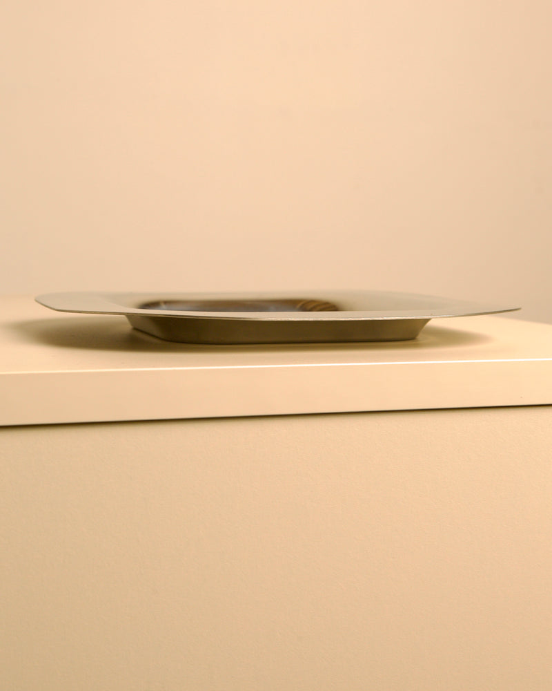 Side view of Italian stainless steel square trinket tray by Sambonet