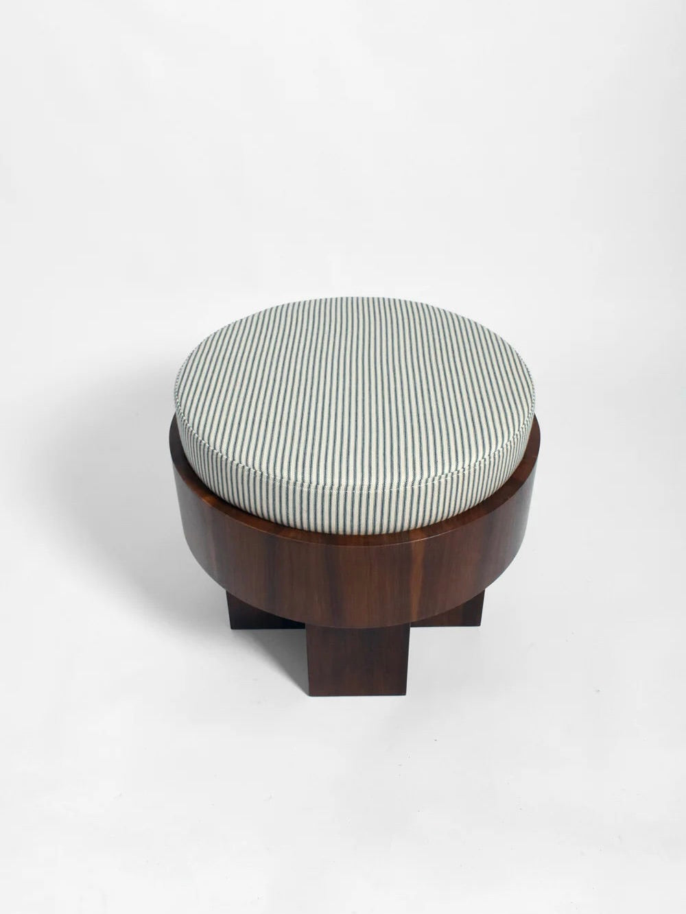 The "Vitruvio" Walnut stool by Barracuda Interiors features a round dark walnut base and a white-and-light-blue striped cotton cushion, made in Portugal, shown against a plain white background.