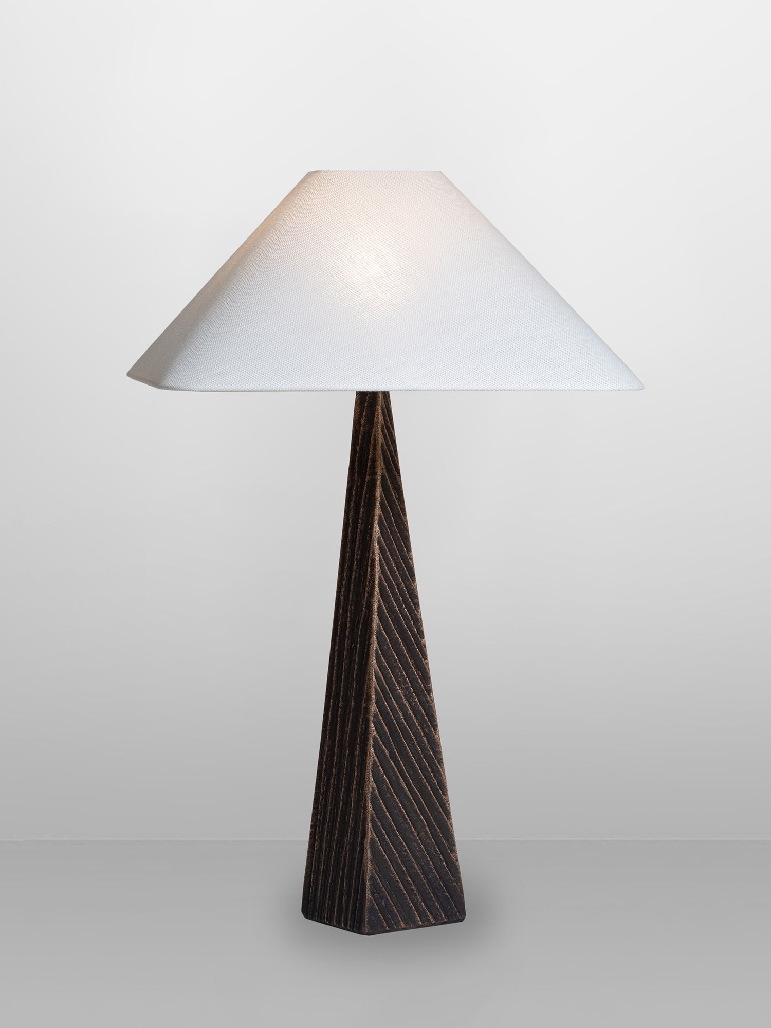 CUBIST Table — close-up of dark wood base and white shade