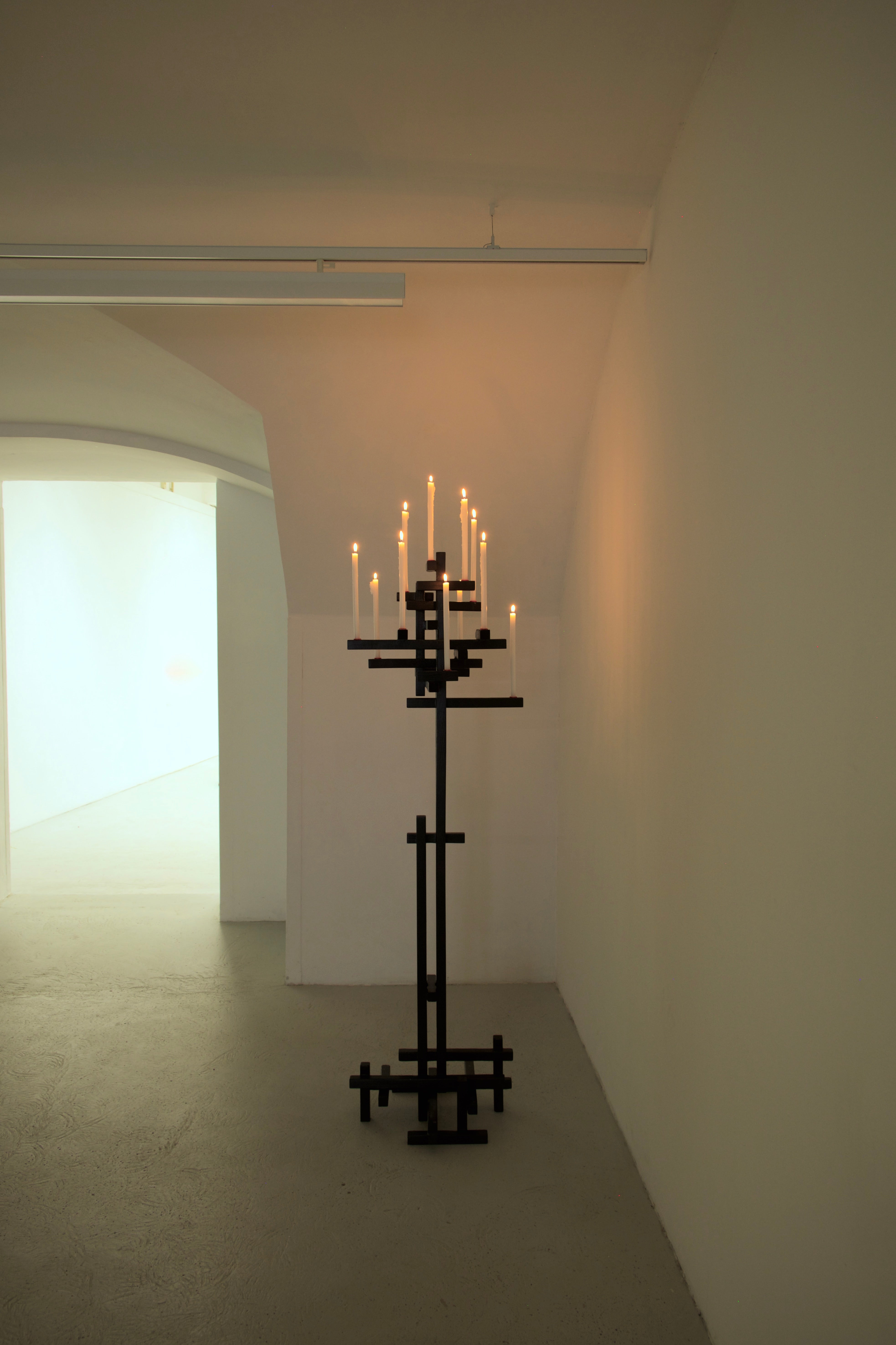 TETRIS CANDELABRUM — black metal candelabrum in minimalist gallery setting