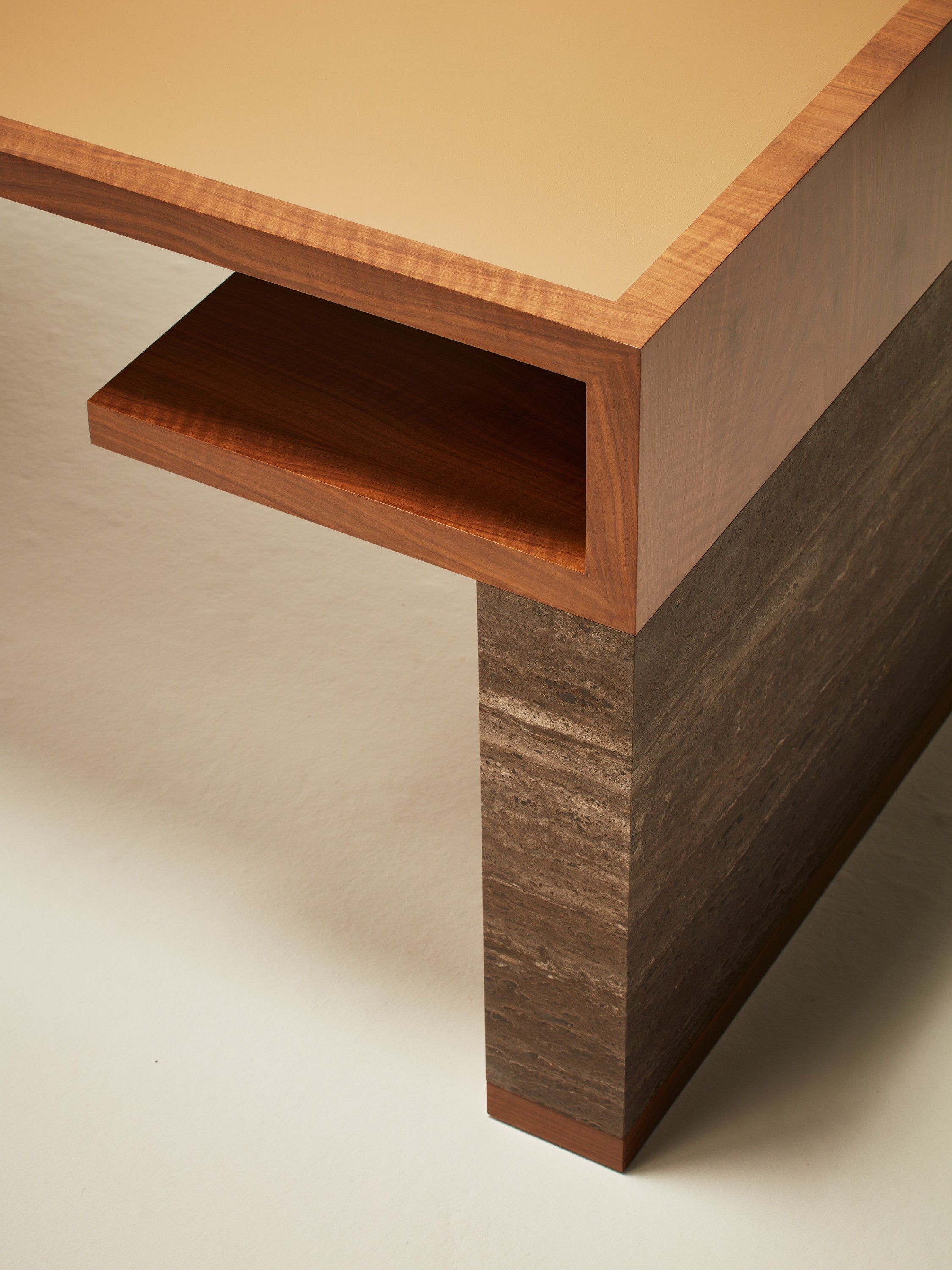 'Continuous' Desk Handcrafted in Wood Veneer With a Lether Tabletop & Travertine Leg — side angle