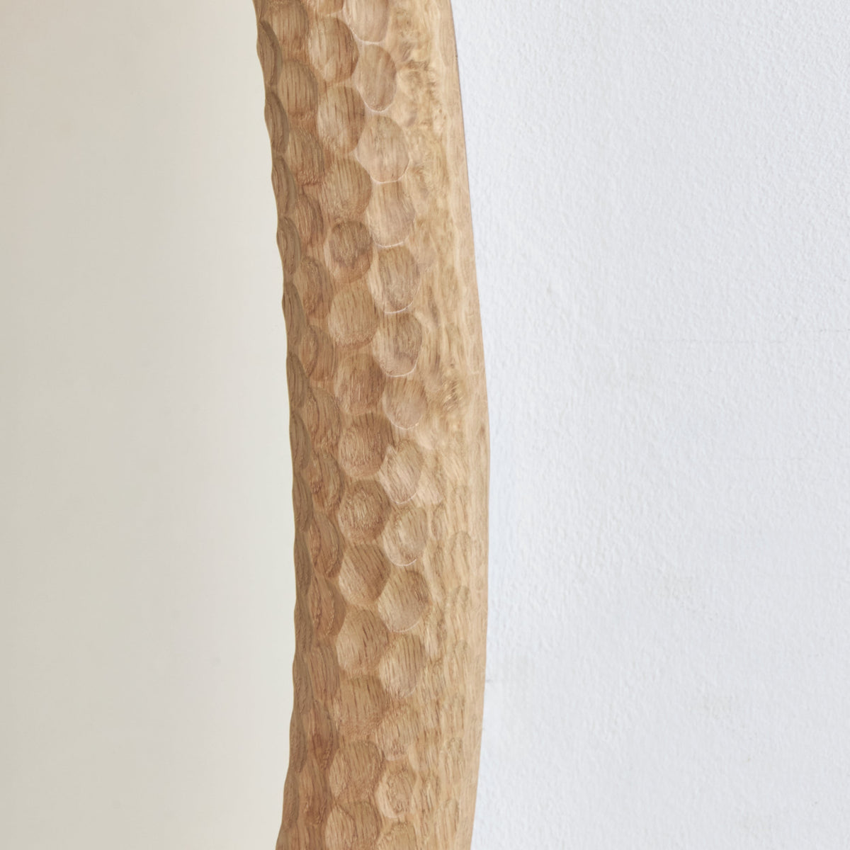 Oval Amarante gouged wood Mirror — side angle