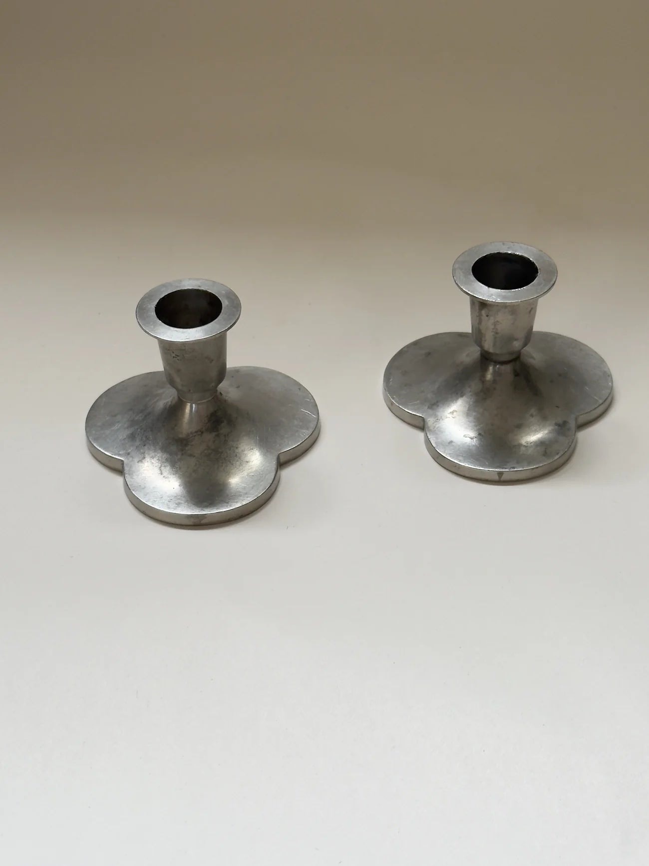 Pair of Pewter Candlesticks by Just Andersen — back view showing round bases