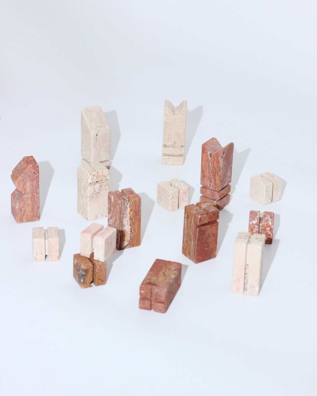 Modernist Chess Set — close-up of abstract stone pieces on white background