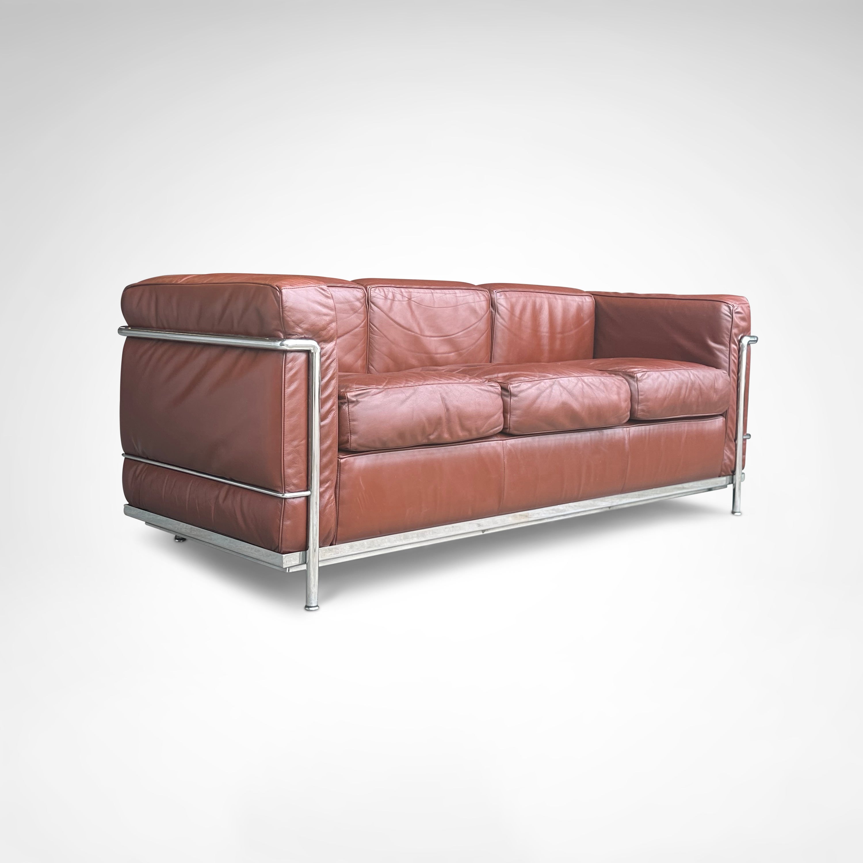 Early production LC2 leather 3-seater sofa by Le Corbusier et al Cassina 1970s — angled view highlighting rich brown leather