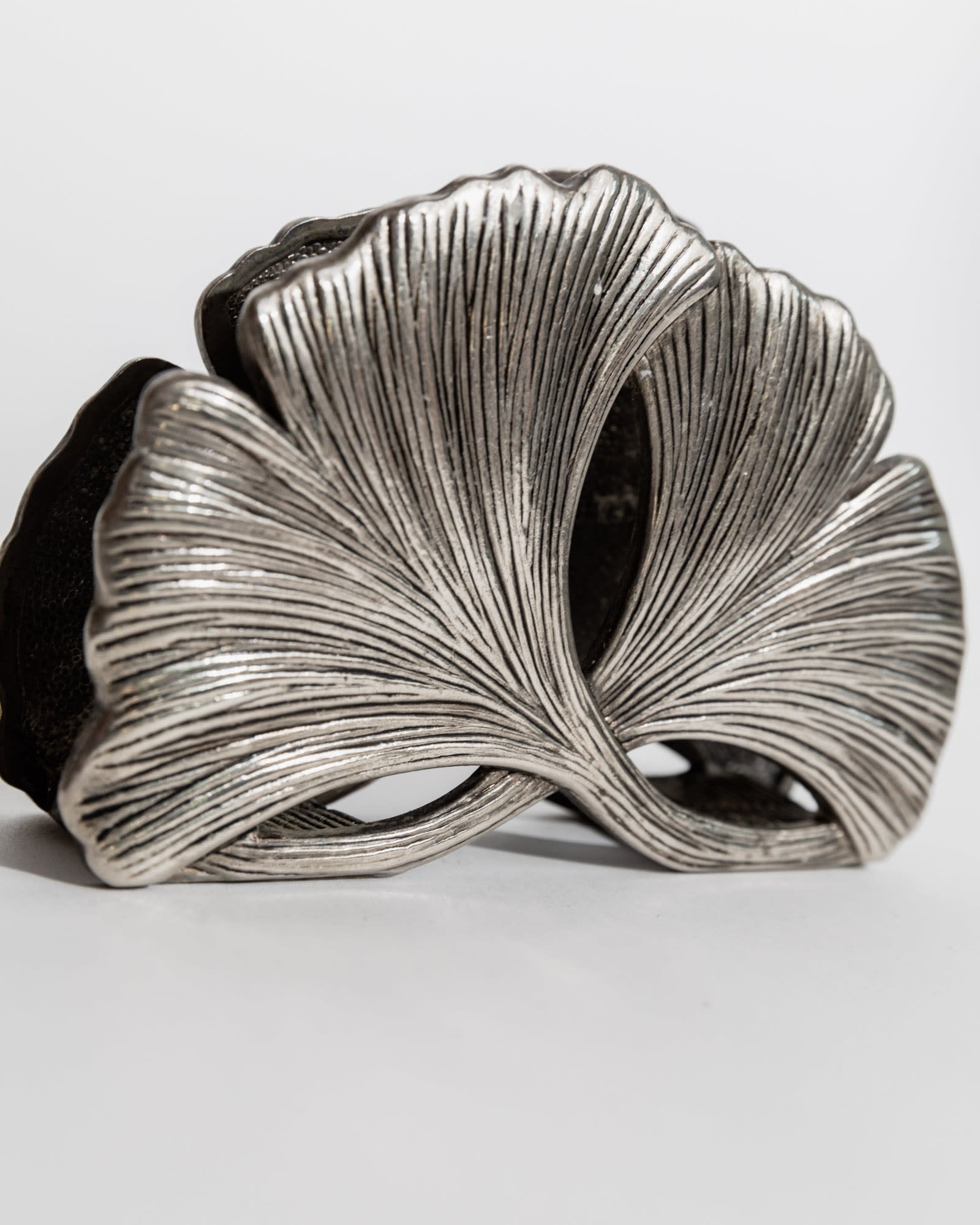 Sculptural silver plated holder with ribbed fan-like design detail