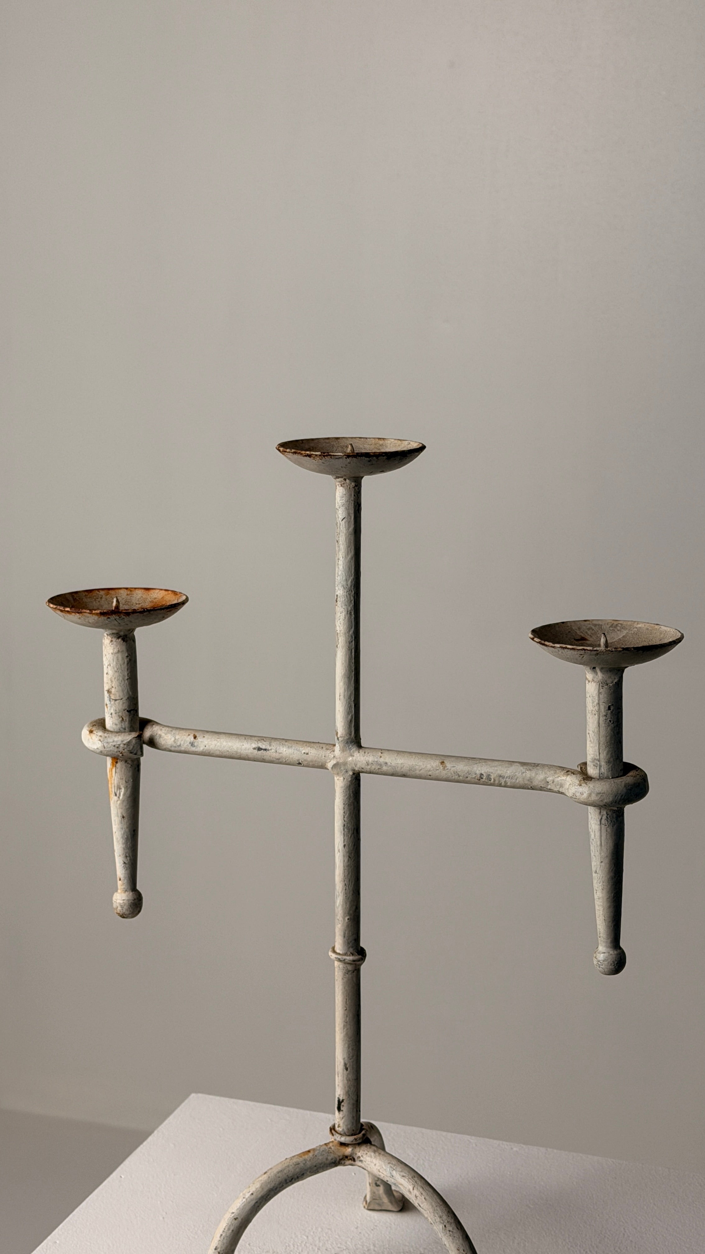 White-patinated Iron Candelabrum, France, early 20th century — side angle showing three candle holders