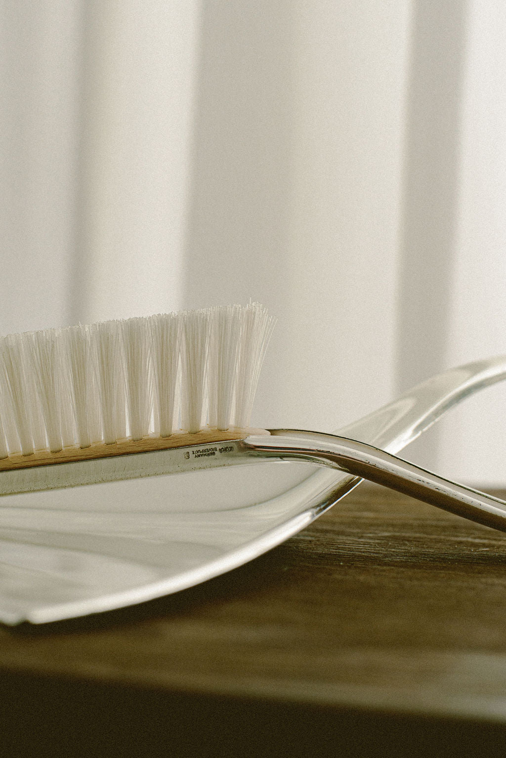 WMF Ikora Table Pan & Brush — side angle showing stainless steel pan and brush