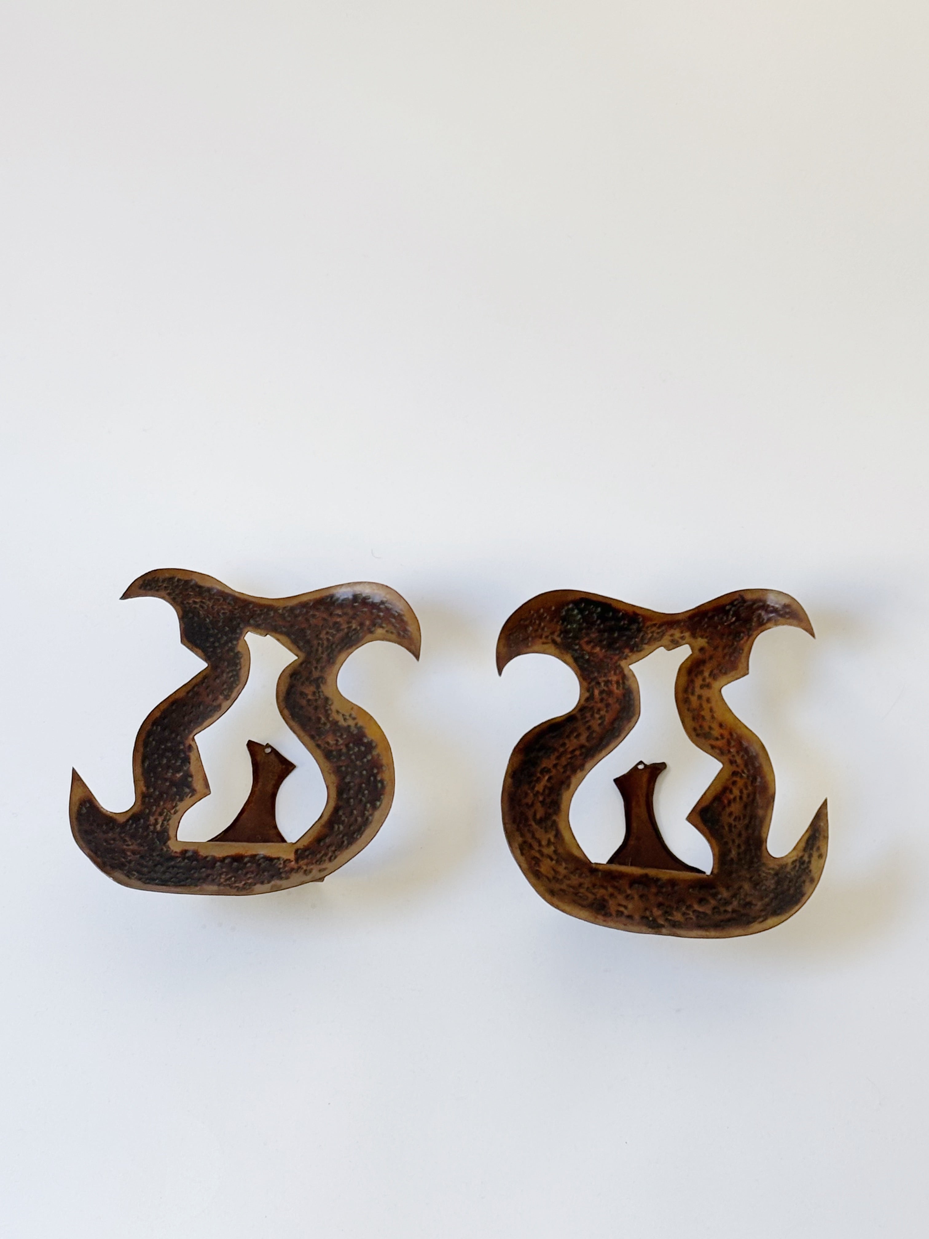 Pair of Torch Cut Metal Wall Candleholders, Poland — side angle