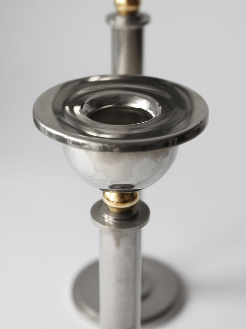 Silver plated candle holder detail showing brass accent rings