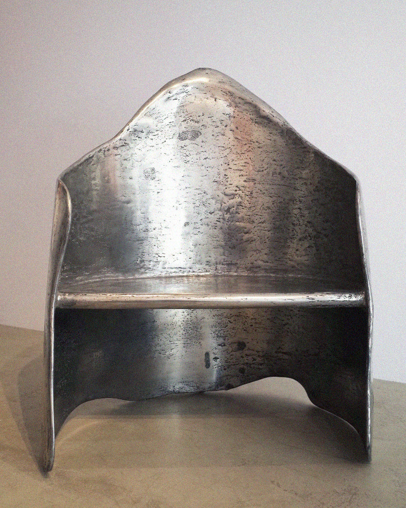 AMAIA polished aluminum-brass resin armchair side profile view