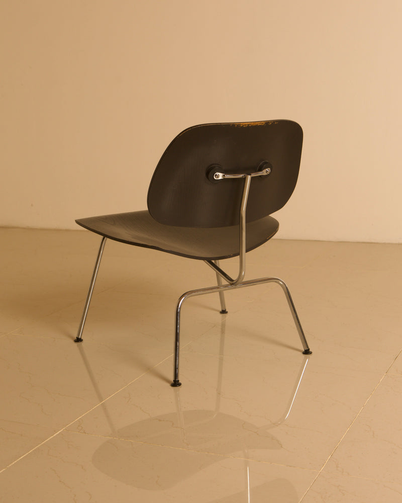 LCM Chairs by Charles and Ray Eames for Herman Miller, 1960s — rear view on polished marble floor