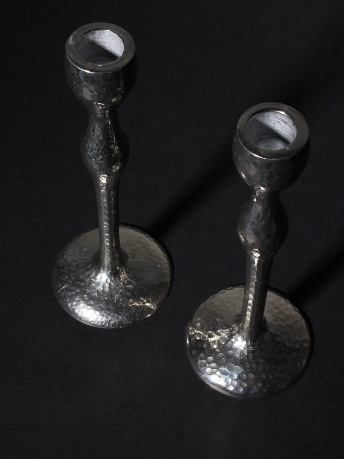 Pair Of Tall Textured Mirror Metal Candlesticks — detail view