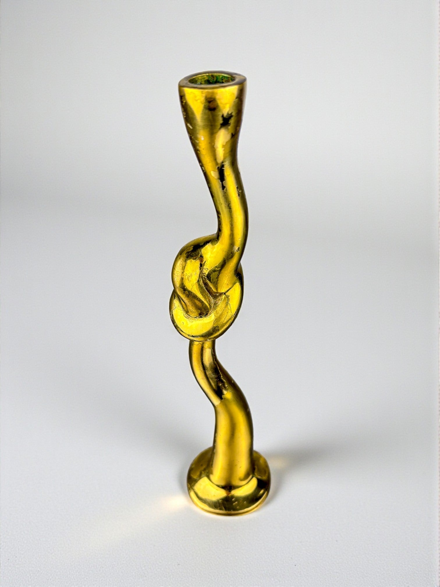Italian Brutalist Knot candlestick in bronze, 1970's — lifestyle setting