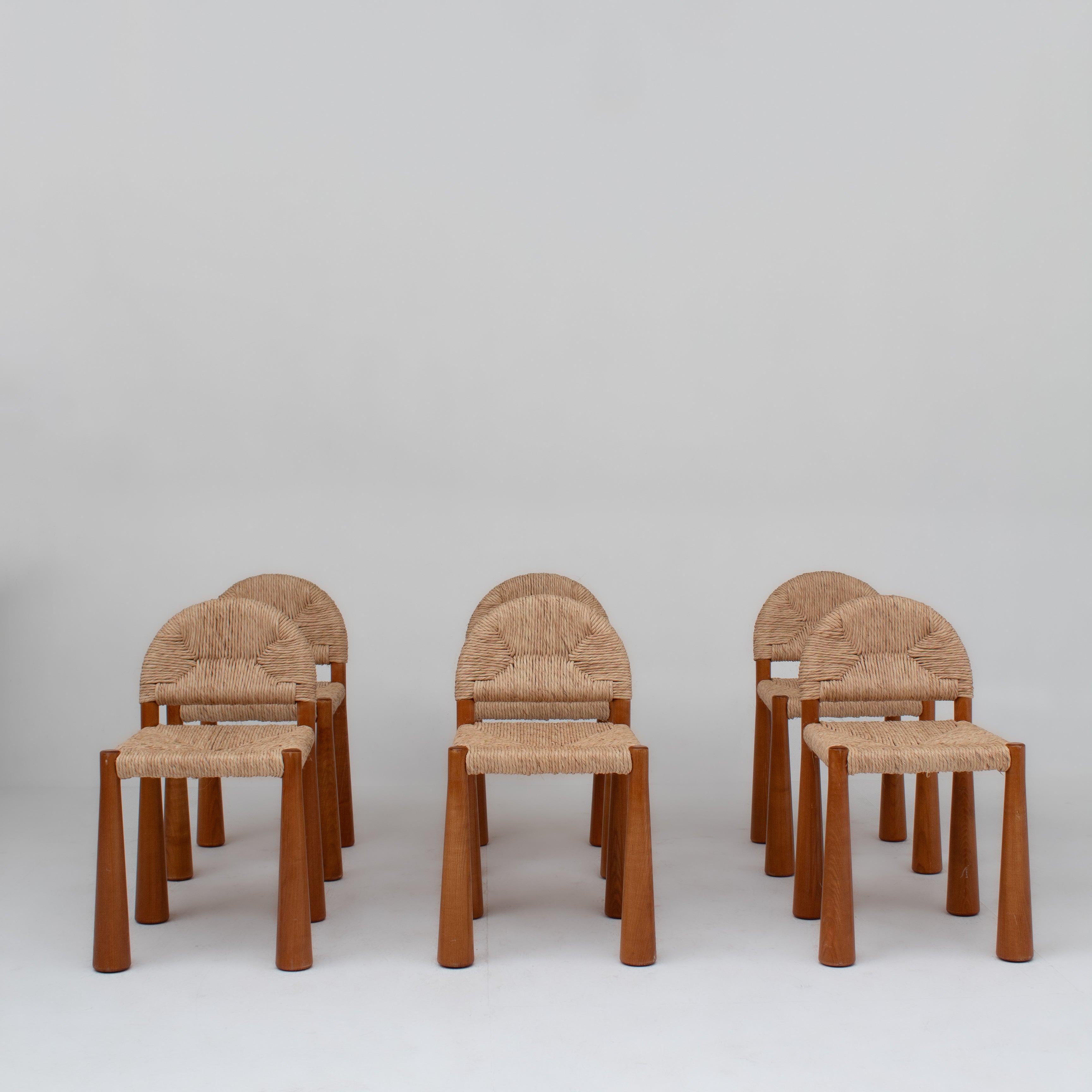 Set of 6 “Toscanolla” Dining Chairs by Alessandro Becchi for Giovannetti — front view highlighting woven seats and wooden leg