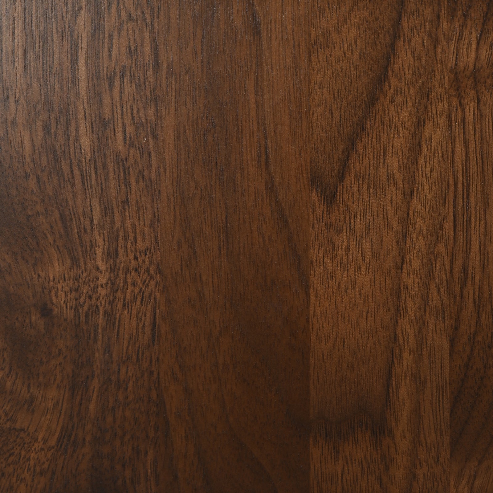 Elmyr Dining Table — close-up of rich walnut wood grain