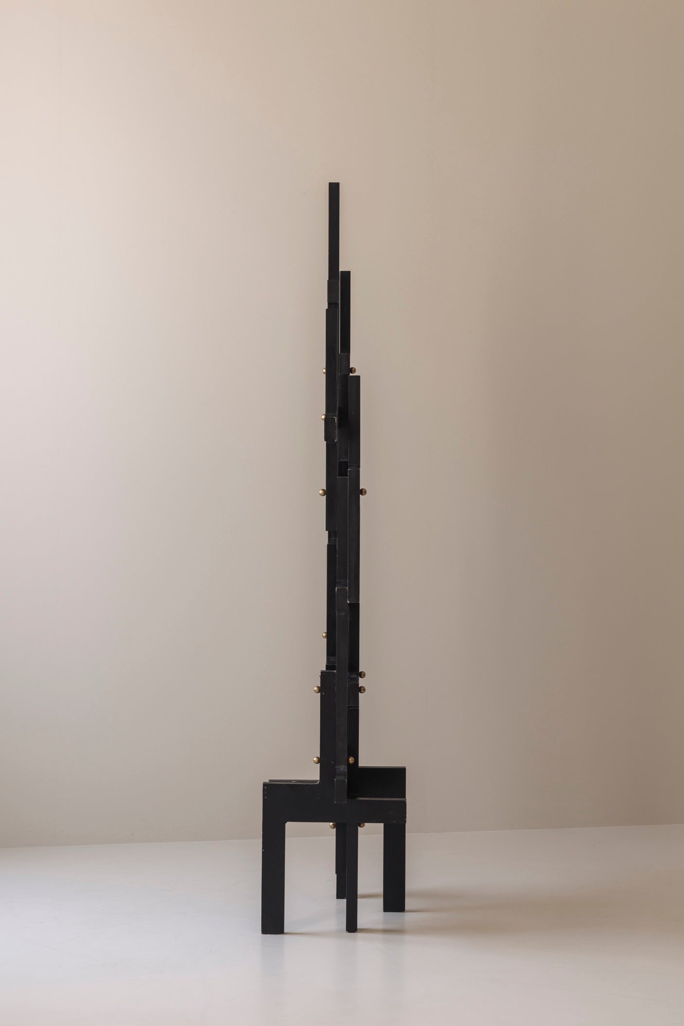 Large geometric abstract sculpture in lacquered wood and brass, France 1990s — in context