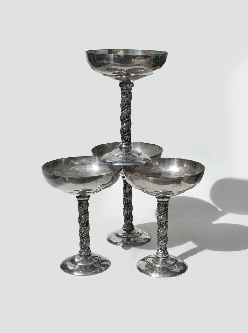 Set of 4 elegant glass coupe glasses with ornate twisted stems