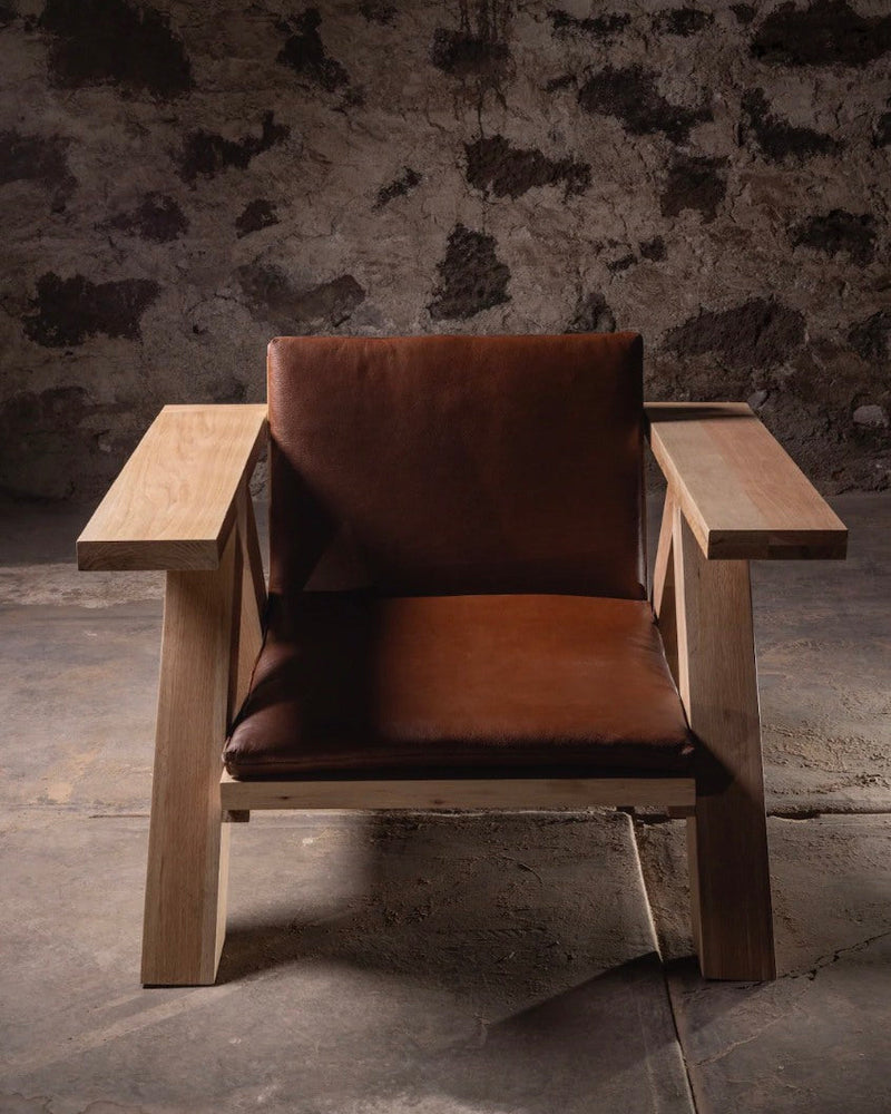 TTR lounge chair with cognac leather cushions and oak frame