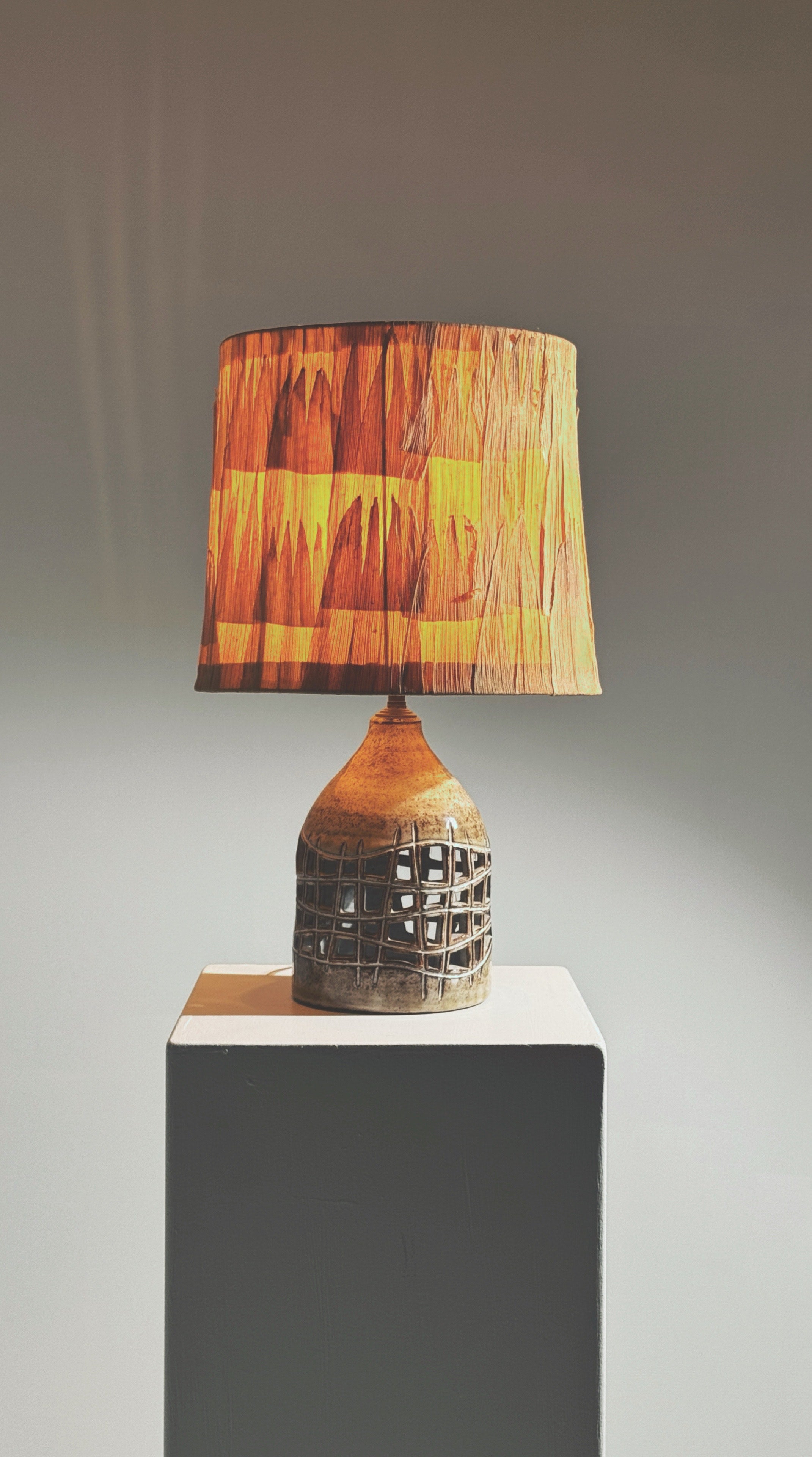 Elegant pierced lamp by Robert Pérot, Vallauris, France, circa 1960 — side angle showing woven shade and ceramic base