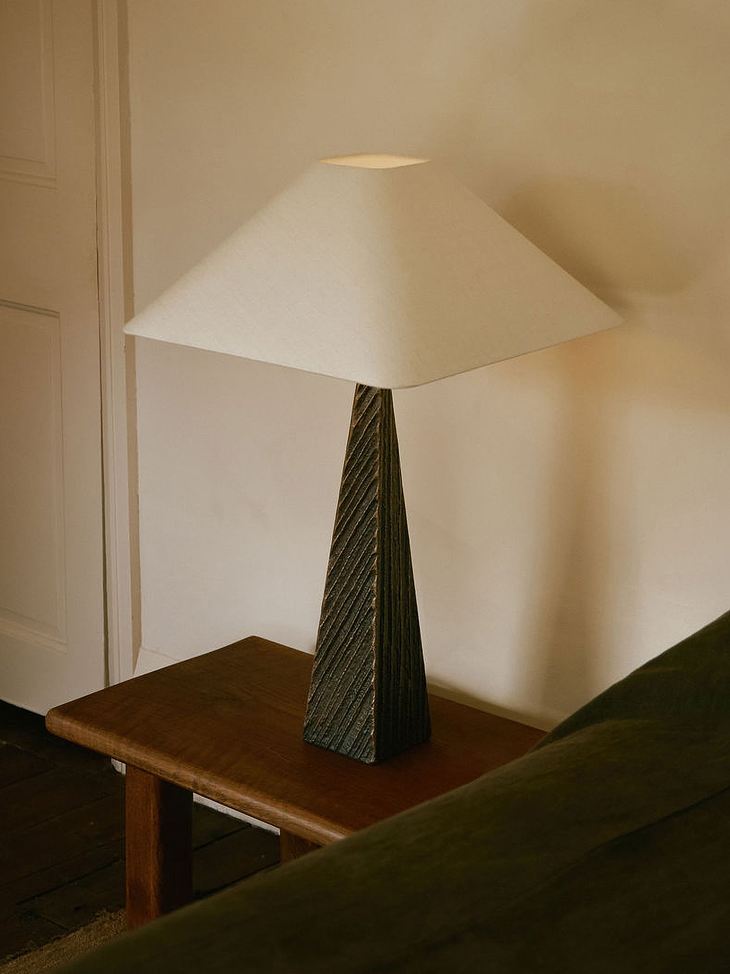 CUBIST Table — angled view on wooden side table in living room