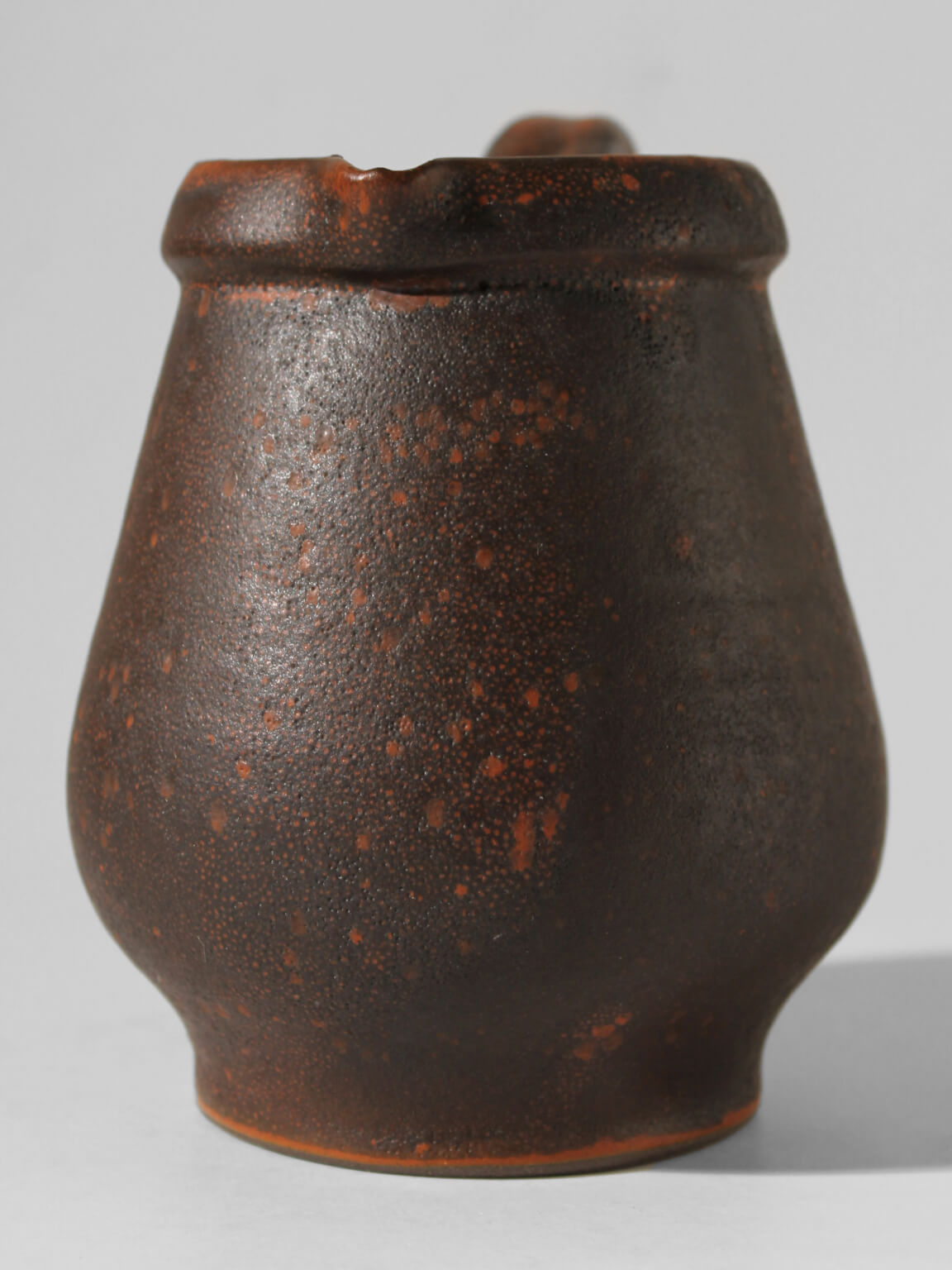Hartwig Heyne Dark Brown Rustic Jug 1L — back view highlighting textured ceramic surface