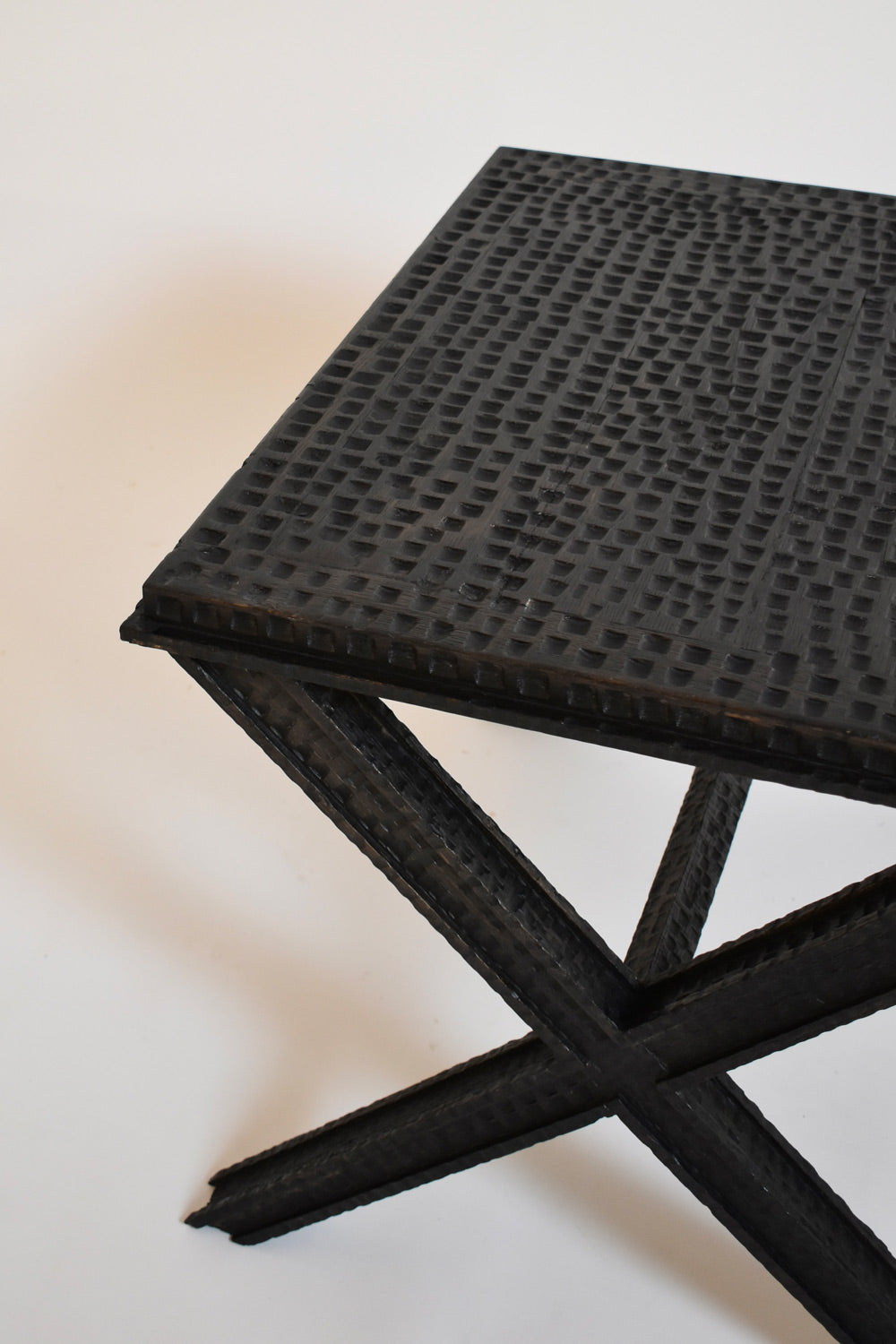 Brutalist Gouged Wood Coffee Table — top view of textured black wood surface