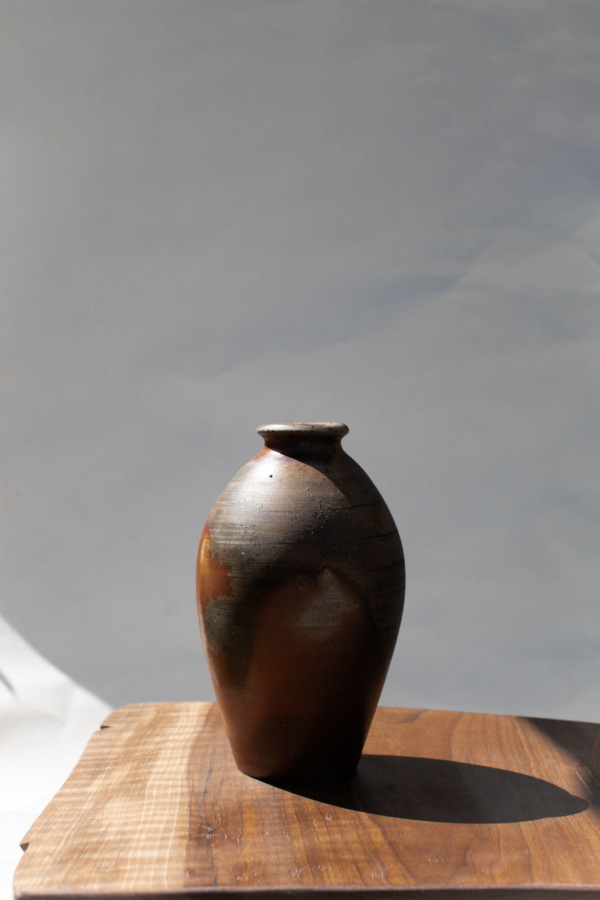 Vintage Ceramic Vase — side view on wooden surface