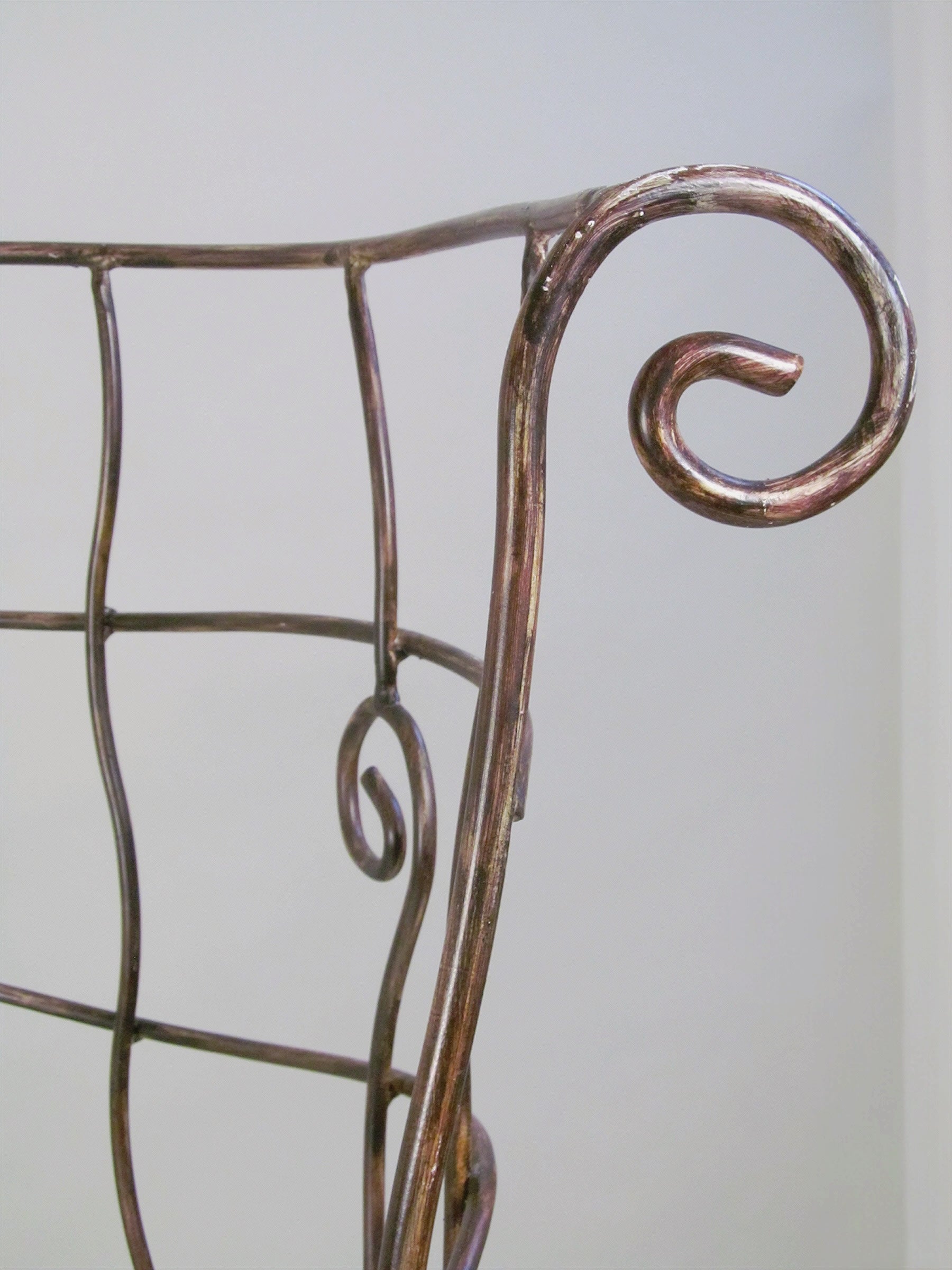 Scrollwork Iron Bench — close-up of iron scroll detail