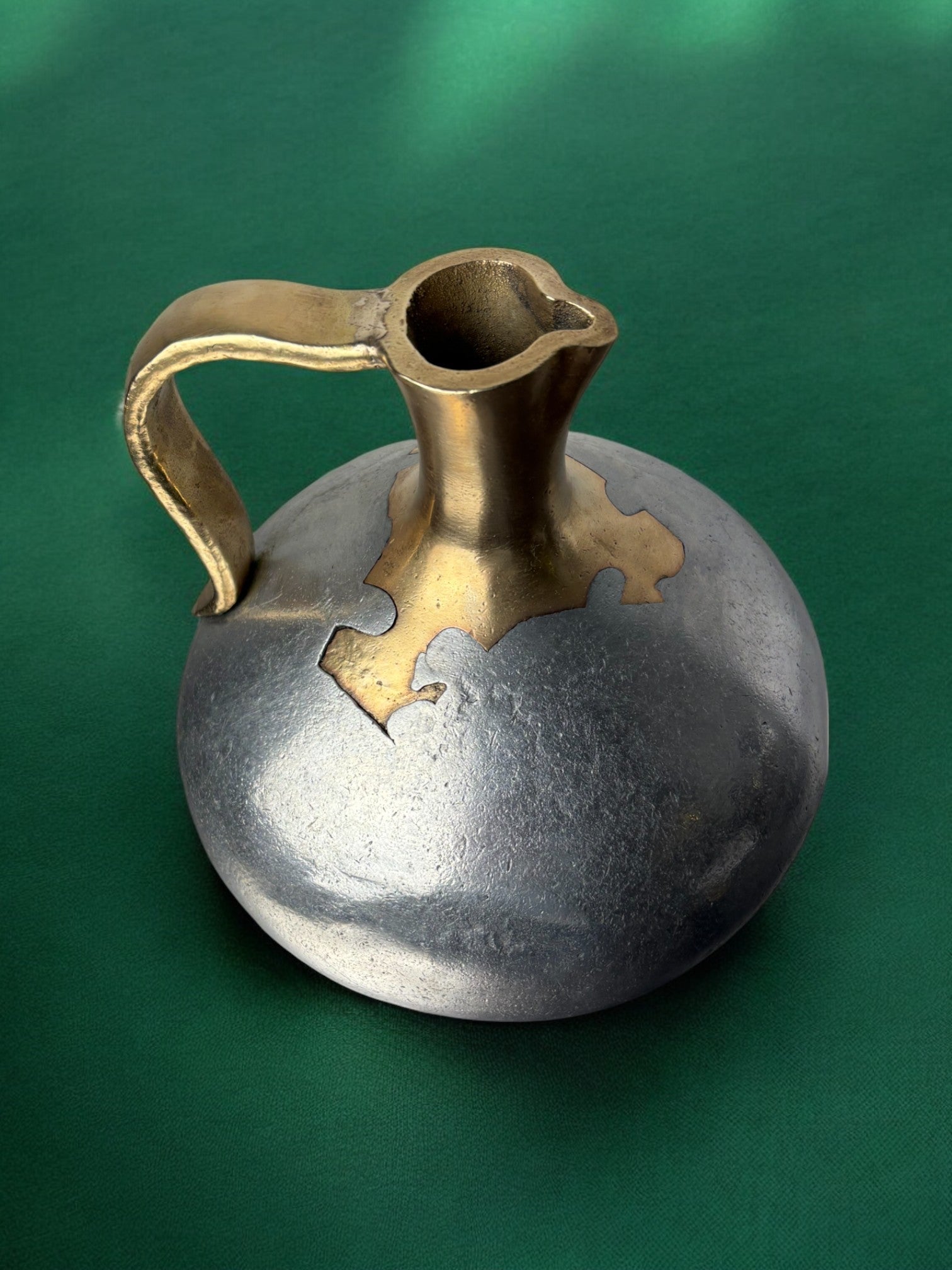 Brutalist Pitcher by David Marshall, 1970s — top view highlighting metallic surface and handle