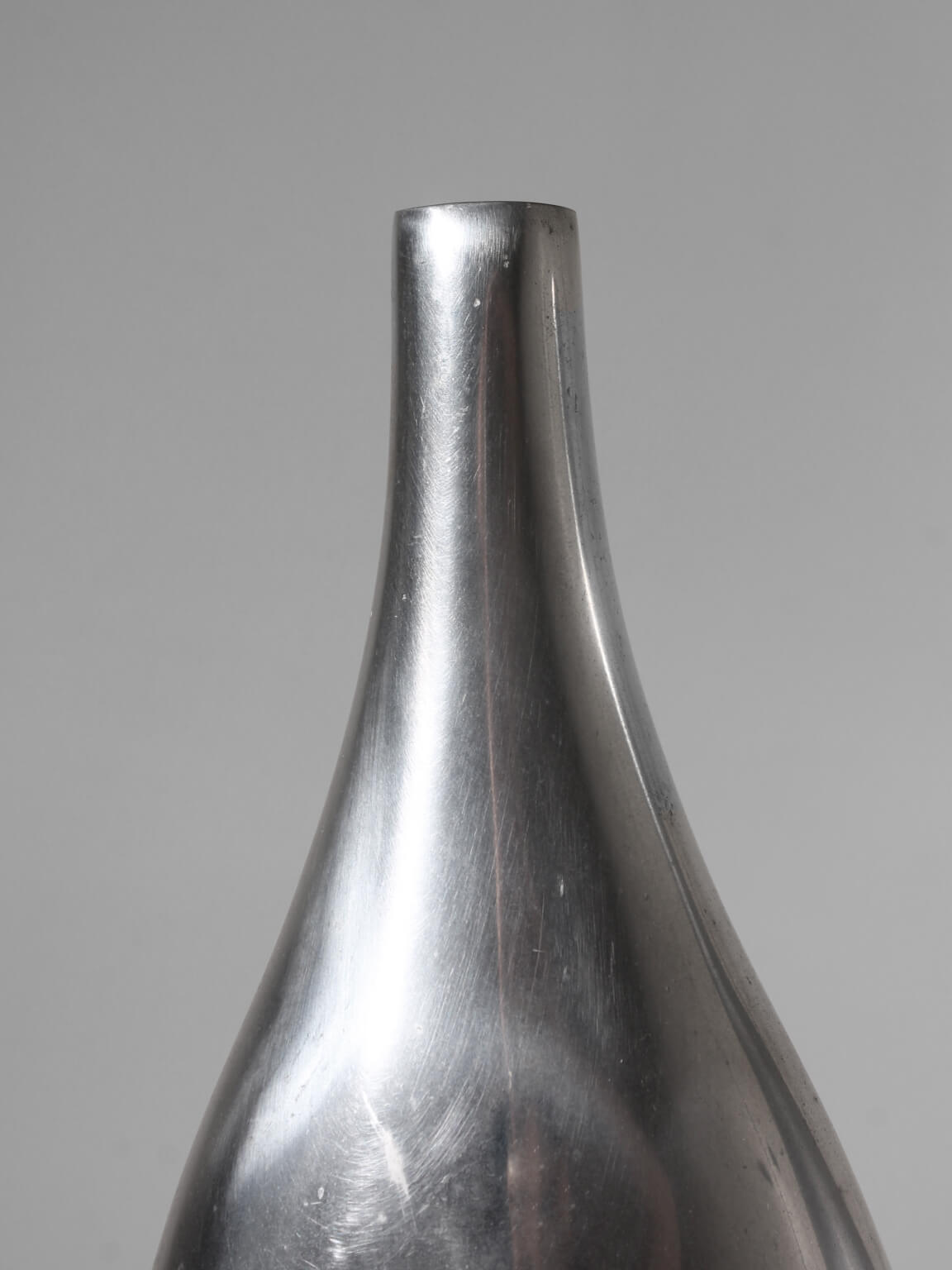 Pair Of Polished Aluminum Tall Vases — side angle