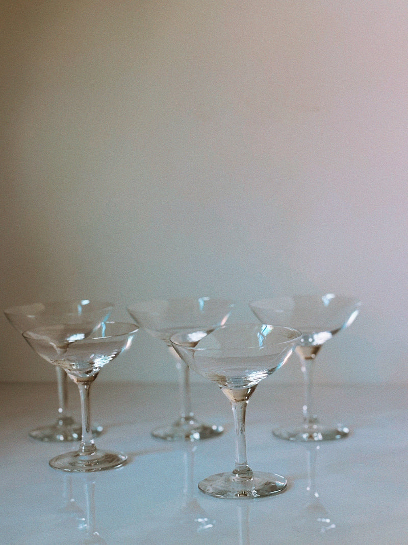 Art Deco cocktail glasses atmospheric view with soft lighting