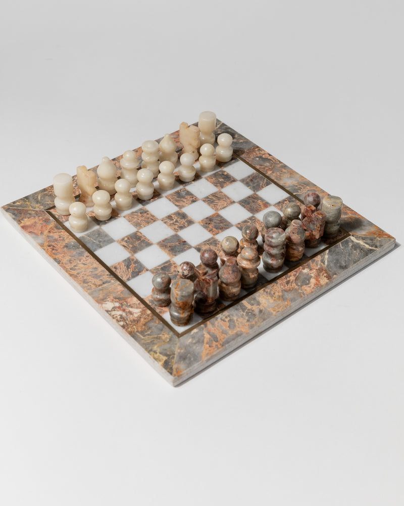 Vintage marble chess set with carved pieces on checkered board, Italy 1960s