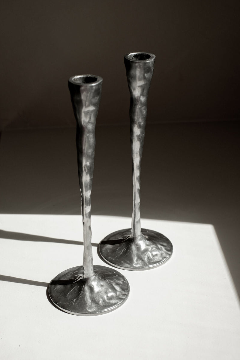 Pair of Aluminium Candle Holders — close-up of textured metal surface
