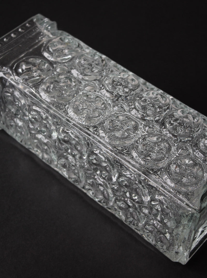 Close-up detail of pressed glass patterns on Czech vase surface